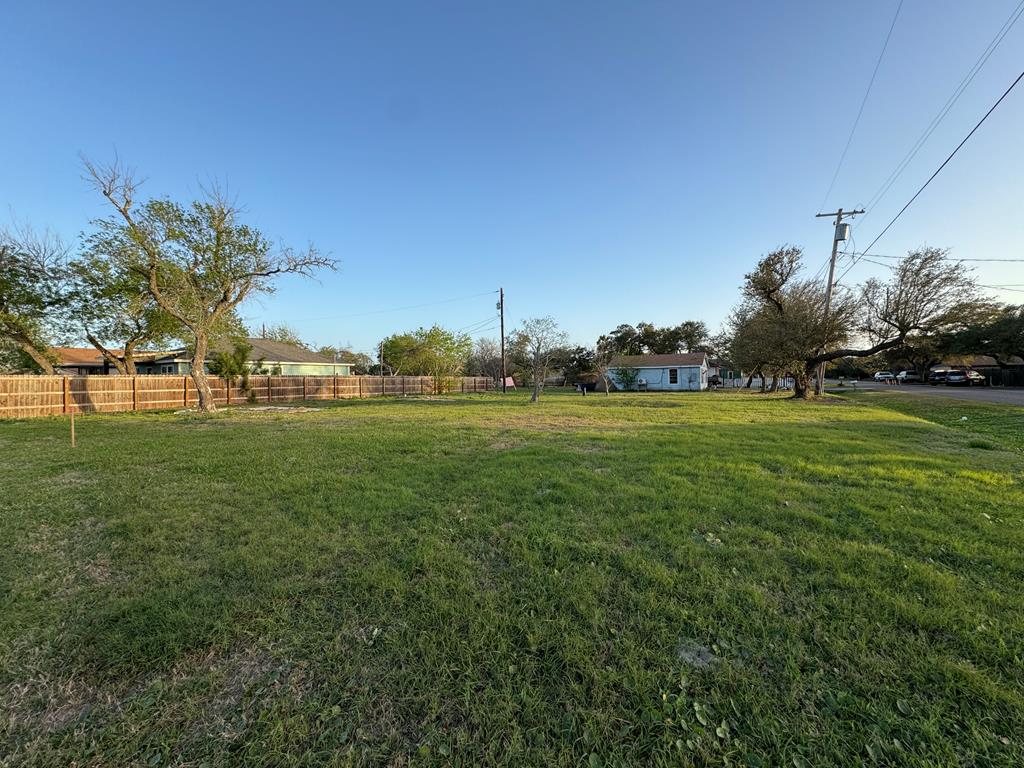 Discover the ideal spot for your dream coastal home on this beautiful corner lot located within the city limits, just a stone's throw away from downtown Rockport and steps away from a charming park. With the lot already cleared, you have a straightforward starting point to bring your vision to life in our wonderful community a breeze. You'll appreciate the proximity to shopping, dining, the Art Center and a quick drive to Rockport Beach. Embrace the opportunity to be a part of this vibrant neighborhood and enjoy all the benefits this convenient location has to offer!
