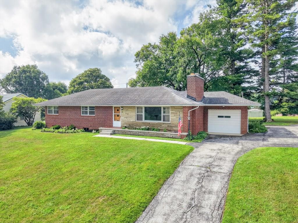 Planted in the heart of Rural Retreat, this classic 3-bedroom, 1-bath brick ranch has been cherished by one family for generations and is ready to welcome its next chapter. Built with incredibly solid construction, this home showcases the quality craftsmanship of its era. Step inside to discover all the original charm, including plaster walls, white oak hardwood floors throughout, original lighting fixtures, and beautiful Mid-Century Modern design elements that have stood the test of time. The spacious vintage-tile bathroom is true to the home's character, offering a timeless style that's becoming increasingly hard to find. The full unfinished basement provides abundant storage or the opportunity to expand your living space, while the attached one-car garage adds everyday convenience. Outside, you'll find a near one-acre, level lot with mature shade trees creating the perfect setting for backyard gatherings, gardening, children at play, or simply enjoying a peaceful afternoon. The property is adjacent to the Rural Retreat Community Park and is conveniently located within walking distance of Rural Retreat Middle and High School, blending small-town convenience with a welcoming community atmosphere. Homes like this don't come along often.