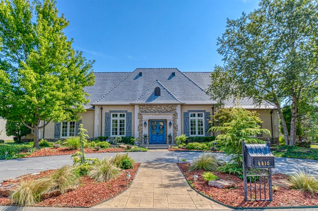 Loaded top to bottom with style & class. Beautiful woodwork throughout. Plenty of high end features: Wood floors, grand Kitchen with island and granite countertops. Sub Zero Frig/Freezer, 6 Burner gas Cooktop, Double Ovens, Bosch dishwasher and gorgeous Wine Closet. High ceilings, inside Safe Room, wrought iron staircase rail, 14 ceiling fans, Special Greenhouse, Nice Pergola and Lg screened-in Gazebo. High-end Davinci shingles with copper gutters, 3 newer A/C units & hot water heater, new Anderson windows, 2 floored attics, 8’ solid core doors throughout, Central Vac System, Central audio/speaker system inside & out. Everything downstairs except 1 Bed, Bath and Bonus Room up.