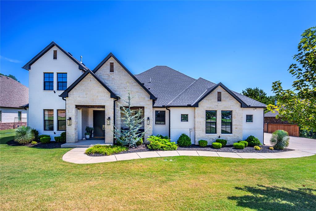 This Exceptional Custom-Built home in Mustang Schools is one you won't want to miss! Offering luxury finishes, smart-home infrastructure, incredible outdoor living and a private wooded backdrop. The heart of the home is a dramatic open-concept living, kitchen and dining area with an approximately 30-ft cathedral ceiling, fireplace with custom built-ins, surround sound and abundant natural light. The chef-inspired kitchen features a massive 5’ x 10’ granite island, custom cabinetry, LED accent lighting and a walk-in pantry with countertop, cabinetry, outlets and window.Luxurious primary suite includes an oversized tiled shower with rainfall and standard showerheads, custom tiled-in tub with handheld wand, statement chandelier and vanity drawer with built-in electrical. The oversized closet offers 2 custom built-in dressers and exceptional storage. Technology upgrades include whole-home Ethernet, centralized AV/network closet, TV power/Ethernet/coax connections, security-system wiring and generator-ready wiring. Additional highlights include a tankless water heater, walkable attic storage, spacious laundry room and oversized mudroom with 6 cubbies, extensive cabinetry and granite drop zone.The 3-car garage includes a unique drive-through single-car bay with front/rear doors and separate side entrance equipped with a storm shelter.Outside is an entertainer’s dream: oversized covered patio with custom shiplap-style ceiling, fans, speakers, Ethernet and plumbing for a future outdoor kitchen. The saltwater Pentair pool features auto-fill, custom lighting, 2 bubblers, volleyball and basketball setups, swim-up seating, 10’ x 10’ lounge area and 10-ft Smith slide. Plumbing and electrical are already run for a future pool house.Extended irrigation, privacy and wrought-iron fencing, custom tree lighting and a beautiful wooded backdrop complete this one-of-a-kind property with privacy, wildlife views and convenient highway access, a homeowners dream!