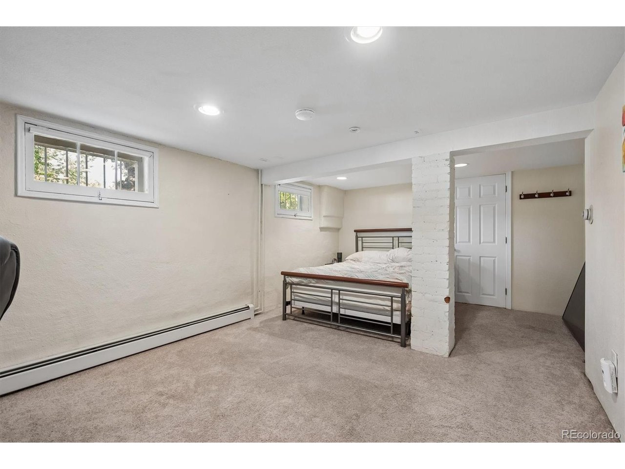 Welcome to this beautiful Denver home in the heart of the City Park area.  City Park Golf course is half a block away and you are only a short walk to City Park, Denver Zoo, and the Museum Of Nature and Science. When you pull up, you'll notice the freshly painted exterior and the big covered front porch.  Walk through the doors into the living room and you will love the beautifully refinished hardwood floors.  The updated kitchen features granite countertops, newer cabinets with soft close drawers and doors, and stainless appliances.  The main level also includes a gas fireplace, dining room, full bathroom, and a sun-porch/solarium to enjoy the sunshine and large backyard.  The garden level basement has a large bedroom, another bedroom, laundry, and a big updated bathroom with an extra deep soaking tub and separate shower with glass enclosure. Newer windows allow the home to take in the southern sunshine! The private backyard is great for parties, featuring a large deck, a separate stamped concrete patio, and even a garden area. The detached, oversized 2-car garage is large enough for extra storage and a shop, and there is an additional Tuff-Shed for more storage.  The owners just installed a new heat pump to provide both heating and cooling.  The home also includes a sprinkler system and the washer and dryer are included.