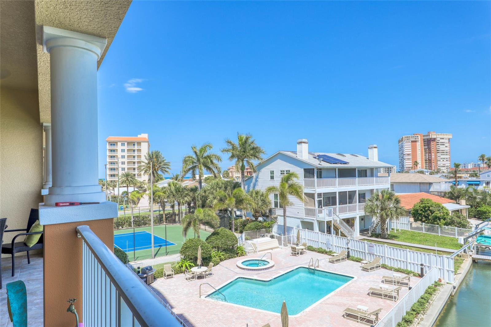 ENJOY OPEN WATER VIEWS FROM THIS LUXURY RESIDENCE! If you’re looking for a quiet tropical escape, here it is! Get ready to relax and unwind in nearly 2,000sf, 3-way split, 3 bedrooms (all with walk-in closets) and 3 ensuite full baths. Enjoy the turquois water and boats by day and the twinkling lights by night, PLUS a partial view of the Gulf of Mexico. At the center of this light and airy open living space is the kitchen with a breakfast bar and view of the sparkling water. The master suite has a gorgeous view of the water, access to the OVERSIZED 30’ balcony and double walk-in closets. The master bath is complete with shower, soaking tub, and double sinks. In unit LAUNDRY ROOM with NEW WASHER/DRYER (2019) and additional storage. Recent upgrades: NEW FLOORING installed APRIL 2022, AC 2019 and WATER HEATER 2020. The heated pool is located directly on the intracoastal, you’ll have fun watching the boats and dolphins who come visit. Enjoy resort style living in this private guarded/gate community featuring lighted tennis courts, fitness center, (2) pools, fishing dock & clubhouse, prime under building parking spot #1 (additional covered carport spaces available first come basis for a fee), private coded back gate to protected crosswalk to the beach. You’ll love living on Redington Beach with easy access to fine dining, shopping, beautiful beaches and only minutes to the Gulf of Mexico. Come live your Beach Life now! HOA fee includes: Master insurance, Flood Insurance, Water, trash, basic cable and internet. CALL TODAY!