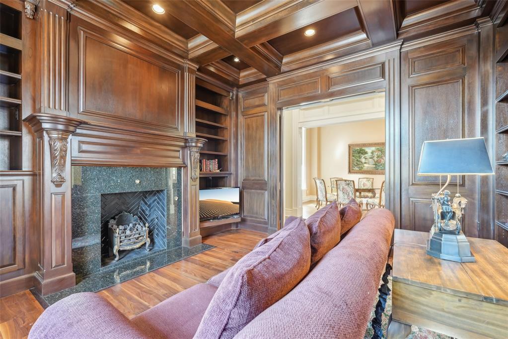 Entering the grand foyer, you are greeted by soaring ceilings and custom wood flooring with intricate 'Wange' inlays—setting a tone of elegance and craftsmanship throughout. Expansive archways lead into a refined library, richly appointedwith dark-stained Mahogany wood, creating a warm and sophisticated atmosphere. Ideal for entertaining, the formaldining and living rooms flow seamlessly into a custom bar area, all framed by expansive bay windows that offerpicturesque views of the surrounding landscape. The kitchen is a enthusiast’s dream, featuring granite countertops,generous cabinetry, and built-in display cases for china and crystal. A high-end gas cooktop, electric double ovens, and acentral island complete this well-appointed space. Adjacent to the kitchen, the Sun Room is bathed in natural light andhighlighted by a charming chandelier—perfect for formal or casual gatherings. A distinctive late 1800's hotel door with acustom wooden vanity from Austria adds a unique touch, while the utility room includes space for a small office area foradded functionality. The master suite is a private sanctuary, with French doors opening to a secluded patio. The masterbath includes a hidden vanity, a spacious garden tub, separate shower, and a private toilet area, complemented bya generous walk-in closet. Upstairs, a versatile bonus room awaits, complete with built-in wooden cabinetry, office desk,and a three-quarter bath with a walk-in shower—ideal for use as a home office, media room, or guest suite. Two additional bedrooms share a well-appointed Jack and Jill bathroom, providing both privacy and comfort for family or guests. Outdoors, the covered patio features a concealed entertainment center-offering a perfect space for alfrescorelaxation. Topping it all is a durable and elegant DaVinci roof, installed just five years ago, ensuring lasting quality and peace of mind. This home exemplifies timeless design, luxurious detail, & exceptional livability.