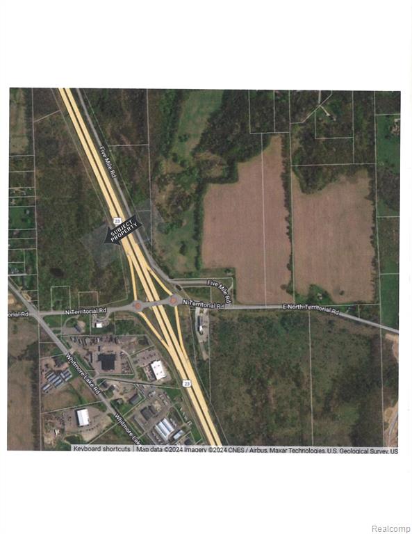 Vacant 37.55 acres ($138,000.00 per acre) Zoned Commercial, Master Planned Mixed Use.  Freeway Exit.  First Exit North of Ann Arbor.  All Utilities. Possible split with premium on N. Territorial Road.  Includes two Property ID #'s:  B0220200004 & B0220200006.  All data & measurements are approximate and should  be verified.