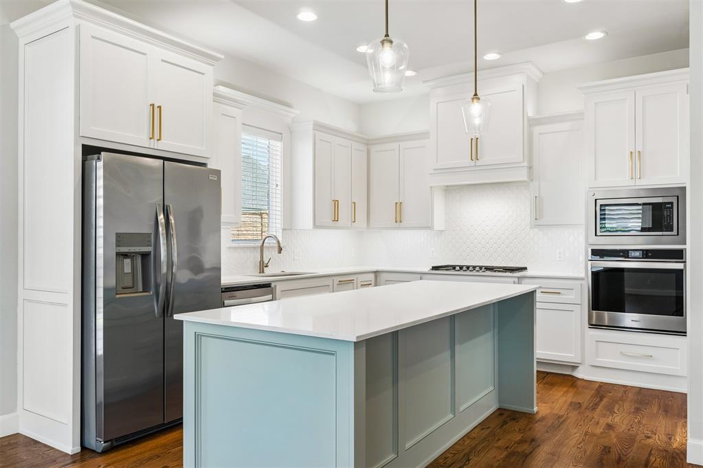 Lovely Craftsman home in Deer Creek perfectly situated at the end of a cul-de-sac directly across from the community park on a spacious .27-acre lot. Built in 2021, this impeccably maintained home looks as though it has never been lived in and showcases undeniable quality, top-of-the-line finishes, and a thoughtfully designed floor plan. Arrive to exceptional curb appeal with lush landscaping and a stained fence that reflects the care poured into this property. Inside, rich stained hardwood floors lead you into an inviting open-concept living space designed for everyday living. White plantation shutters add timeless elegance. A stacked stone fireplace with gas logs create the perfect focal point and cozy atmosphere. The kitchen is sure to impress with its oversized island, white cabinetry accented by gold hardware, abundant storage, and a spacious pantry. Premium built-in appliances include a gas cooktop, oven, microwave, dishwasher, and refrigerator, making this kitchen as functional as it is beautiful. Privately tucked away, the primary suite offers a peaceful retreat and a luxurious ensuite featuring dual vanities, a soaking tub, a tiled walk-in shower with a glass door, and a spacious walk-in closet that conveniently connects to the laundry room. This room is equally impressive with ample cabinetry, countertop workspace, utility sink, and a washer and dryer. On the opposite side of the home, two secondary bedrooms share a well-appointed hall bath with dual sinks and a tub/shower combo. Just off the 3 car garage, you'll find a convenient mudroom with a built-in bench, creating the perfect drop zone for busy households. Upstairs, the versatile fourth bedroom features a large walk-in closet and its own full bathroom, making it an ideal guest suite, bonus room, second living area, home office, or media room. Step outside to enjoy the oversized backyard with plenty of room for grilling, outdoor games, pets, or simply relaxing in the privacy of your fully fenced yard.
