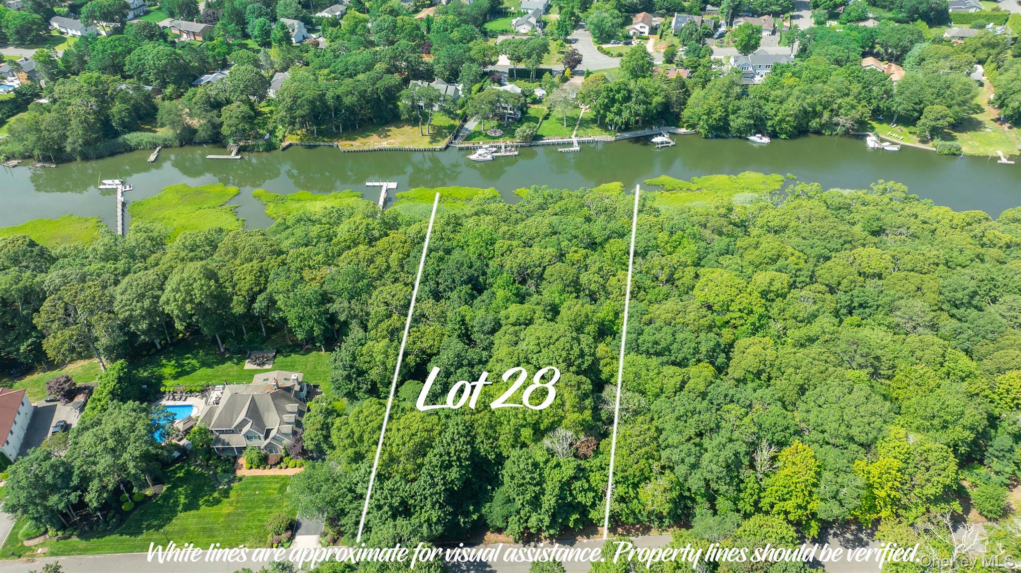 Nestled within the coveted Baywood community, this exceptional 2-acre waterfront property offers a rare opportunity to build a custom home in a setting defined by natural beauty, privacy, and coastal elegance. With approximately 200 feet of pristine waterfront, the property provides an extraordinary backdrop for a residence designed to embrace its spectacular surroundings. Surrounded by beautiful, mature trees, the property offers a serene sense of privacy while maintaining a direct connection to the water. Imagine beginning each day along the shoreline, spending afternoons on the water, and enjoying breathtaking sunsets reflected across the bay each evening. This is a unique opportunity to create a residence tailored entirely to your vision, with ample space for both indoor and outdoor living. Whether envisioned as a peaceful year-round retreat or a sophisticated coastal escape, this property provides the land, setting, and privacy to bring your dream home to life. Residents of the exclusive Baywood community have the option to join the homeowners association for just $150 annually, helping maintain the beauty and character of the community while providing access to its private park. Opportunities to acquire this combination of 2 acres, substantial waterfront, mature natural surroundings, and privacy are rarely available. Build your custom waterfront residence in one of the area's most desirable communities and create a property that is truly your own. 20 Inlet View Path (MLS #982849) and 22 Inlet View Path (MLS #982767) are each offered at $999,000. A rare opportunity to build a custom waterfront residence in one of the area's most sought-after coastal communities. Inquire today about the custom-build opportunities and make your waterfront vision a reality.