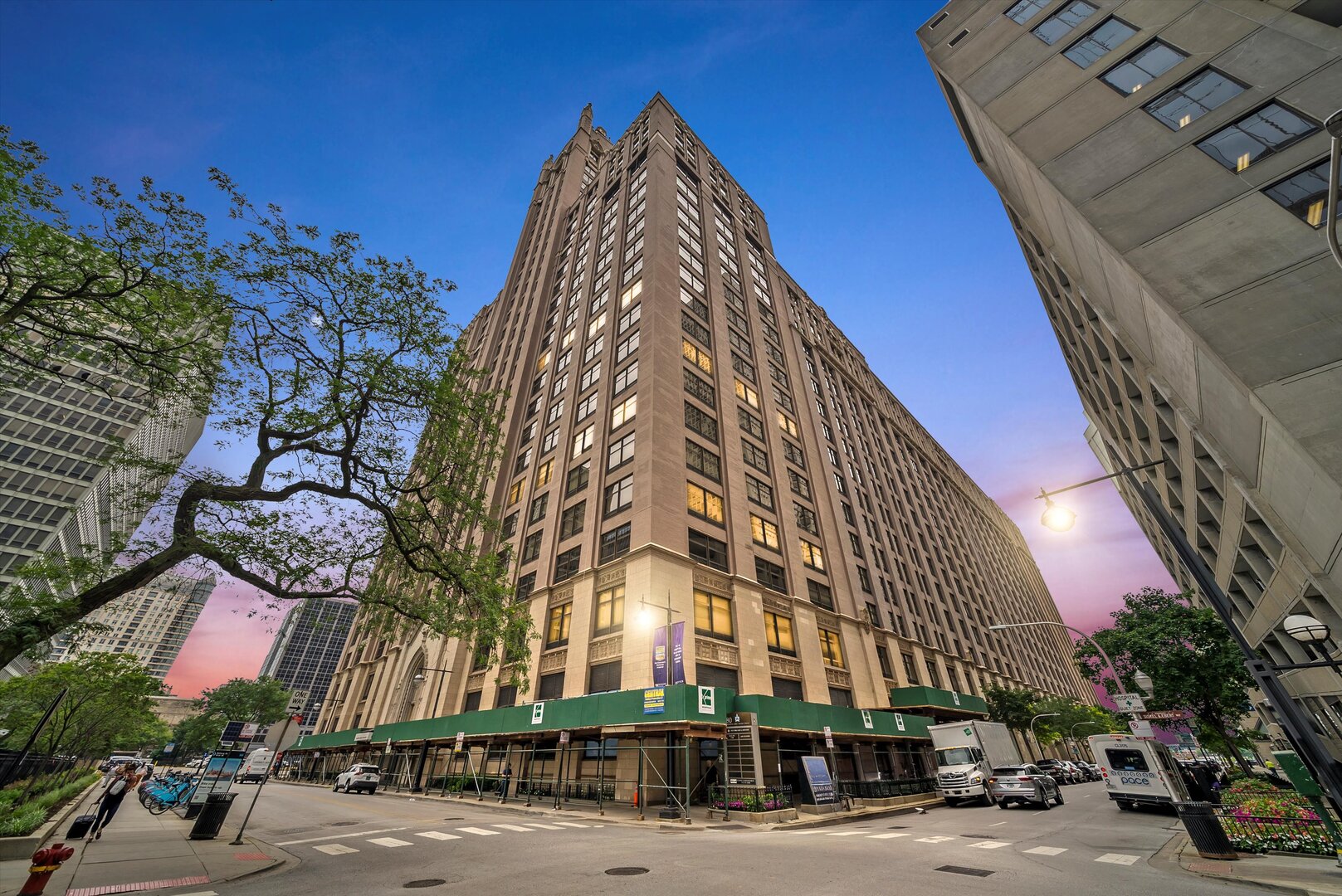 Welcome to a seamless and sophisticated reimagining of 2,100 square feet of elevated city living. This exceptional 2 bedroom, 2.5 bath residence blends the elegance of 1920's Gothic architecture with a clean, modern sensibility resulting in a truly one-of-a-kind home on iconic Lake Shore Drive. Once inside, ten foot ceilings and expansive picture windows frame striking city views and unforgettable sunsets, while a wide open floor plan offers the perfect backdrop for entertaining and everyday living. The thoughtfully designed chef's kitchen is anchored by quartz countertops and sleek custom cabinetry by Leicht, fully accessorized for maximum function and style. Seven inch white oak hardwood floors run throughout, and every bath has been renovated with Leicht cabinetry, quartz surfaces, and beautifully integrated lighting. The oversized primary suite stuns with a custom built walk-in closet and a luxe en suite bath. A generous laundry room offers a Miele washer and dryer, additional cabinetry, and a practical work surface. Located just off the lakefront in the heart of Streeterville in a full service building offering newly outfitted fitness center, indoor pool with whirlpool, on site dry cleaner, valet parking and a casual restaurant. Additional storage, and a deeded private-access garage parking is included in the price. Truly a home that stands apart. Effortlessly refined. Undeniably rare.
