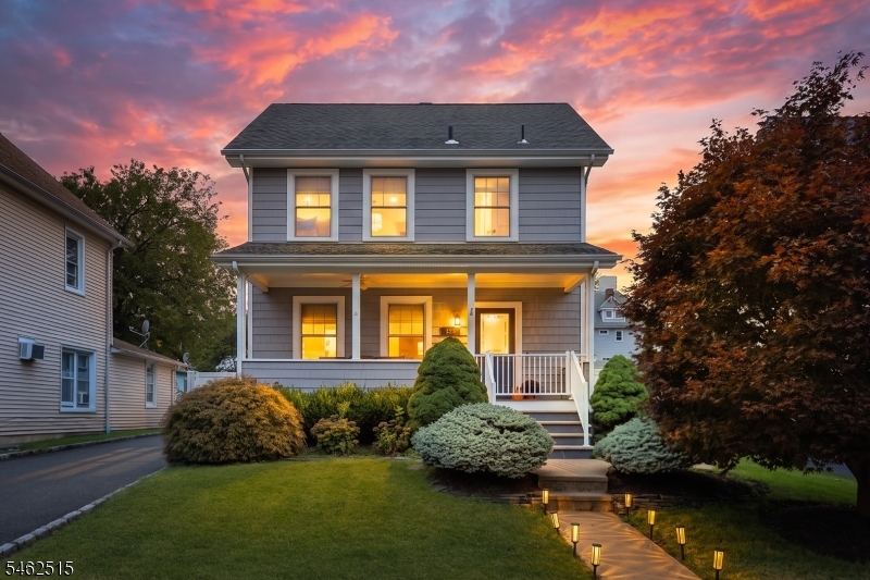 Charming, move-in ready Colonial offering a wonderful blend of classic character, modern conveniences and inviting indoor-outdoor living. A welcoming front porch sets the tone and provides the perfect spot to relax and enjoy the neighborhood. Step inside to a comfortable first-floor layout featuring a spacious living room and dining room, ideal for both everyday living and entertaining. The kitchen is equipped with SS appliances and offers a great space. A convenient powder room and mudroom complete the main level. Upstairs, the second floor features three comfortable bedrooms and a full hall bath. The walk-up third level provides additional flexible living space that can easily adapt to your needs.  An unfinished basement offers even more possibilities for storage or future living space. The outdoor areas are equally inviting and designed to be enjoyed throughout the seasons. A privacy fence with electric gate opener leads to a heated 1.5-car garage, versatile detached retreat and paver patio perfect for outdoor dining, entertaining or simply relaxing. With plenty of space both inside and out, this home offers flexibility for today's lifestyle. Ideally situated for commuters and conveniently located near NYC train and bus transportation, major highways, top-rated schools, the community pool and an award-winning vibrant downtown filled with shopping, dining and entertainment. A wonderful opportunity to enjoy comfort, convenience and a sought-after location!