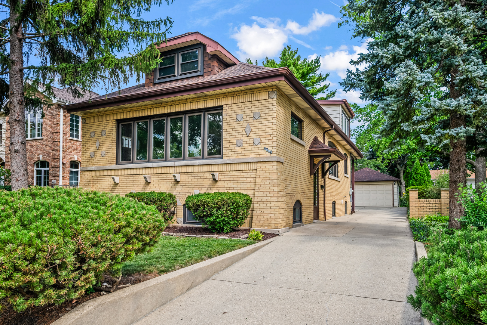 WOW! This classic brick Bungalow is a home you must see!  Thoughtfully restored, updated, and improved, it blends timeless character with modern comfort, making it truly move-in ready.  The main level showcases beautiful hardwood floors, two comfortable bedrooms, an updated bathroom, brand-new stunning kitchen, and a separate dining room perfect for entertaining. Just off the kitchen, an enclosed porch offers the ideal spot for a mudroom or everyday drop zone.  Upstairs, you'll find the inviting primary suite complete with a full bath featuring a walk-in shower, plus a spacious flex area that works beautifully as a home office/playroom.  The basement has been completely finished, providing even more living space, a new laundry area, utility room, storage and convenient exterior access.  This stunning bungalow combines historic charm with fresh updates-ready for you to move right in and enjoy.  This home is ready to move into!