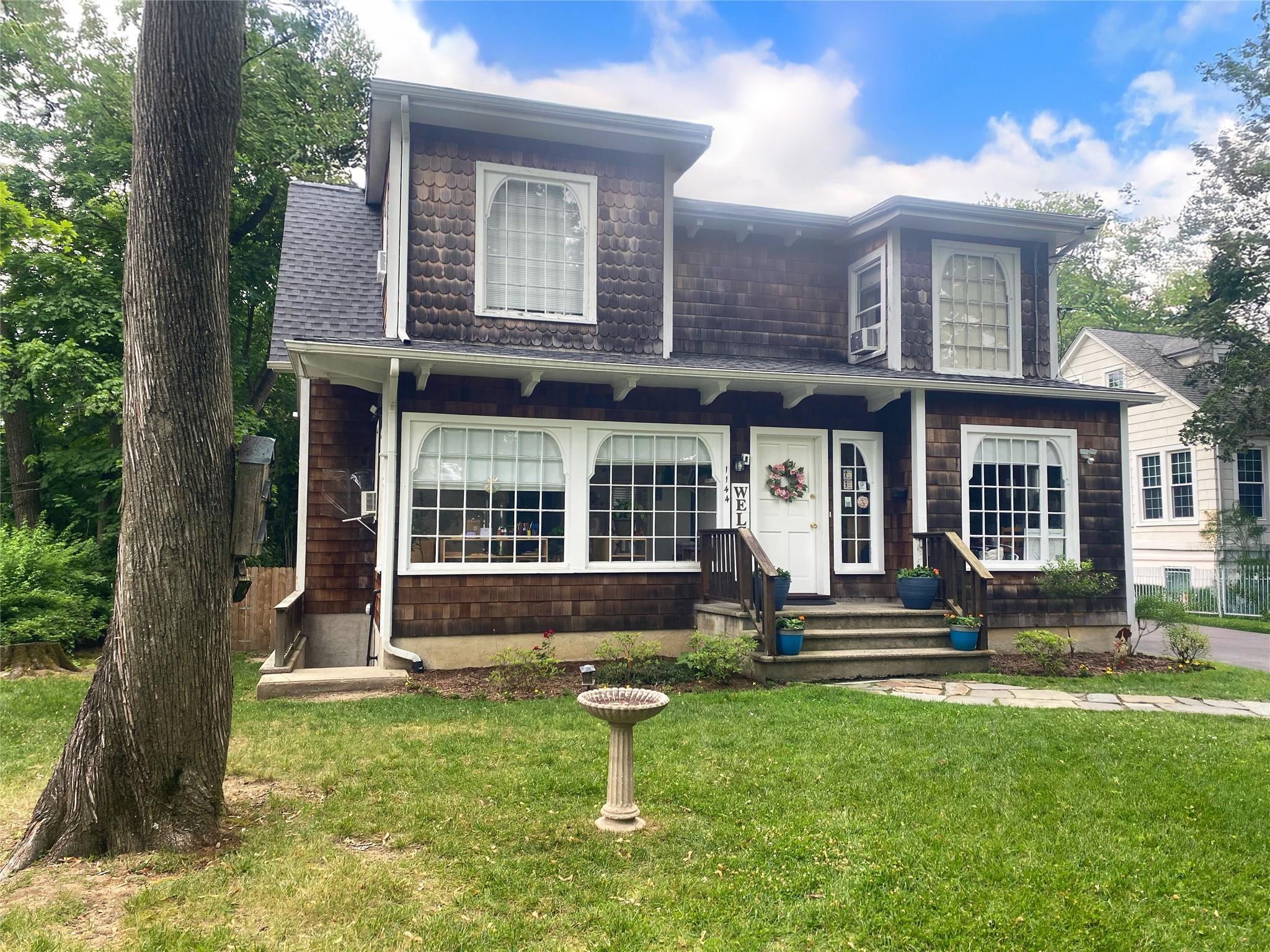 Beautiful colonial with fabulous flat yard.  Nicely set back from the sidewalk'd Avenue.  Convenient to all. Enjoy!