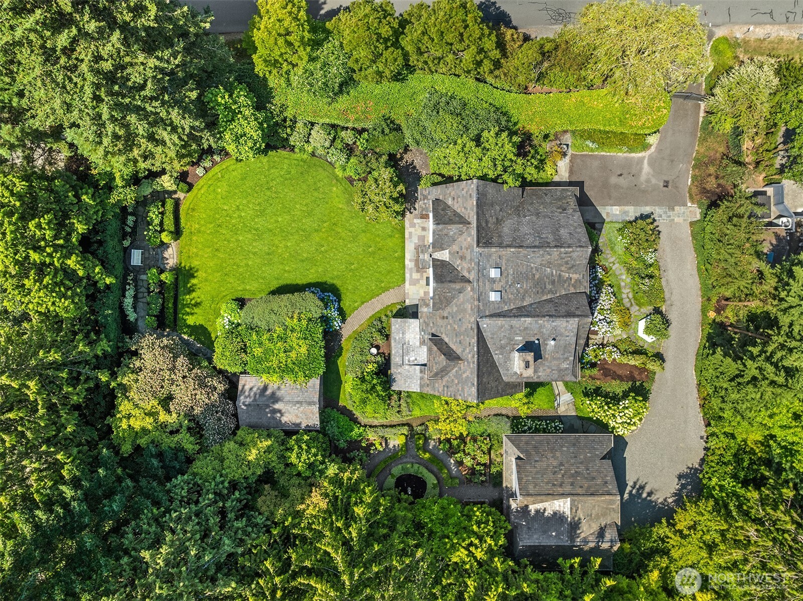 Sweeping aerial view highlighting the expansive, private lot.