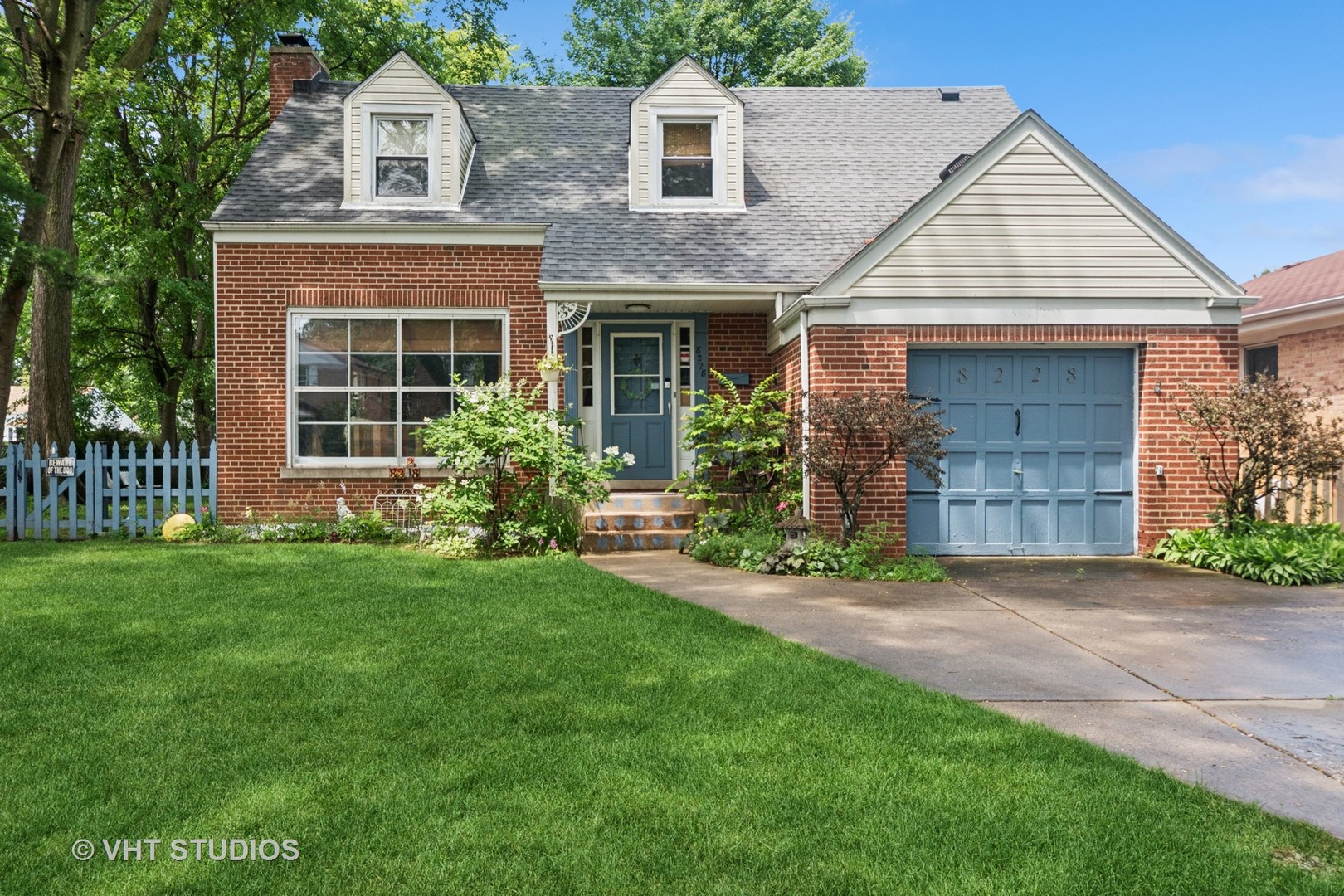 Welcome to 8228 Kedvale Ave in Skokie. This property offers one of the largest lots in the subdivision within a desirable neighborhood. The house has been well-maintained, with a new roof installed in 2023. The air conditioning system was updated in 2023 and the furnace in 2015, ensuring comfort and efficiency throughout the year. The open-floor design connects the living and dining areas, and the wood-burning fireplace provides additional warmth. Hardwood floors cover the main living spaces, while two bedrooms on the second floor have newer carpeting. The kitchen features a range/stove installed in 2022, an eat-in counter, quartz countertops, a new dishwasher, and a new garbage disposal. The four-seasons addition/den offers additional living space. The yard includes flowers, mature trees, and a patio area suitable for outdoor activities. The basement houses a new washer and hot water heater. The fenced yard is ideal for entertaining and summer BBQ's. The property is in School District 73.5 and Niles North High School District 219, and near many parks. 1 Car attached garage with parking pad for 2 cars. Well-maintained home.