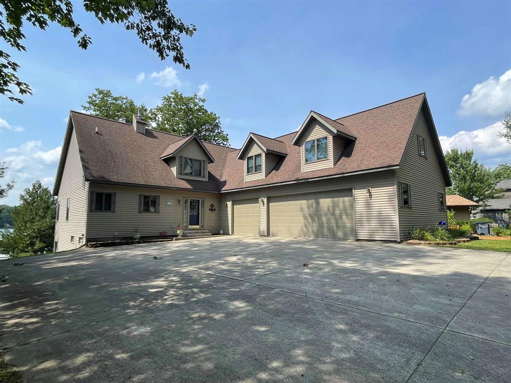 Welcome to your dream custom built waterfront home! This stunning meticulous property offers almost 4000 square feet of luxury finished living space, featuring 5 bedrooms and 4 baths. This beautiful home is nestled in a private subdivision with breathtaking views of serene Arnold Lake in northern Clare County. With 100' of sandy frontage and crystal clear sparkling water on this 118-acre all sports lake, you'll enjoy endless water activities from your own backyard. The home boasts many structural custom built attributes including 2x6 framing, an 8' poured wall full finished basement, custom windows offering views of the water from almost every vantage point, larger natural gas hot water heater, large insulated 3+ car garage with extra high 7' doors, and a maintenance free composite deck overlooking the lake. Step inside and you will delight in the large great room with beautiful views of the lake. A gas fireplace adds warmth and ambiance for cozy evenings. A main floor primary private bedroom/bath offers privacy and solitude. The finished full walk-out basement encompasses a large family room, a full finished bath and finished bedroom. On the upper level are 2 more bedrooms and a huge bonus room that will accomodate all those extended friends and family members. This beautiful pristine home offers many more wonderful ammenities too numerous to mention. We think you will love the primary bedroom suite, the large great room, the kitchen and dining area offering ample room for many guests, and that the quietness of the home. This property is located in upscale Woodshaw Estates subdivision and HOA: a new owner will appreciate the exclusivity of living in a private HOA with Deed Restrictions and By Laws that dedicates itself to ensuring your property values are maintained. Conveniently located just 2 miles from the US 127 exit, this waterfront oasis offers the perfect blend of luxury, comfort, and accessibility. Room for everyone!