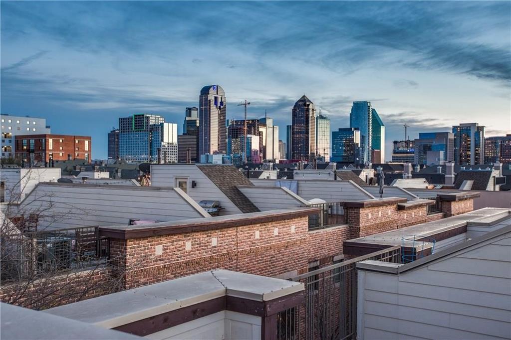 Welcome to 2411 N. Hall Street, Unit 31, a stylish townhome in the heart of Dallas. A beautifully landscaped walkway leads you to the front door and creates a warm first impression. Inside, the first floor features new hardwood floors in the entryway and guest bedroom. The second level offers an open-concept layout with a spacious living, dining, and kitchen area that's perfect for everyday living and entertaining. The kitchen includes granite countertops, stainless steel appliances, a walk-in pantry, and a large island with breakfast bar seating. The third floor is home to the private primary suite, along with a flexible office or den space ideal for working from home or relaxing. One of the home's standout features is the rooftop deck, complete with an outdoor kitchen and hot tub. It's the perfect place to unwind and enjoy views of the downtown Dallas skyline in the evening. Additional features include a gated entrance, attached two-car garage, and a location just steps from popular shopping, dining, and entertainment.