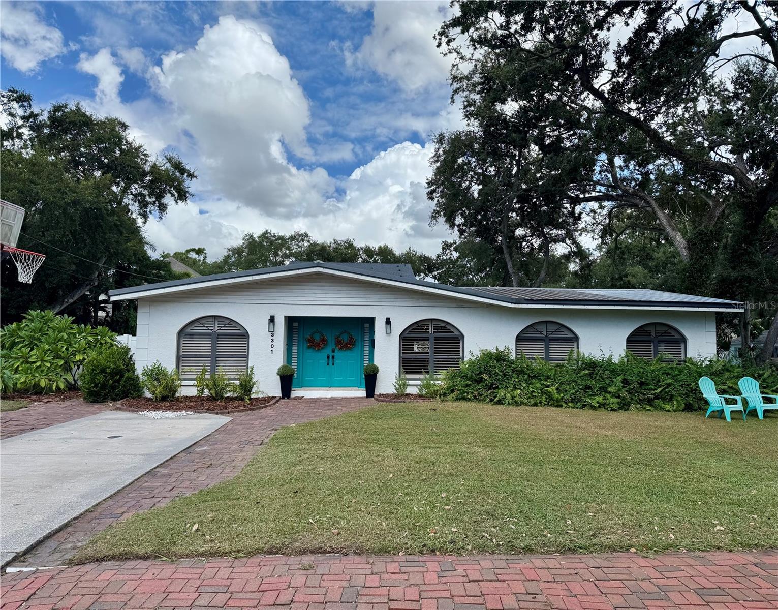 Under contract-accepting backup offers. Fantastic location in the heart of Bayshore Beautiful, one of South Tampa's most sought-after neighborhoods! This area is perfect for leisurely strolls, festive holiday gatherings, and fostering a true sense of community. Just half a mile from the iconic Bayshore Blvd, you'll have easy access to daily workouts and events like the renowned Gasparilla Parade of Pirates. Step into this welcoming home through its grand double-door entry into a bright foyer. The mid-century design features an open floor plan, seamless tile plank flooring, and custom plantation shutters for an upscale feel. Spacious kitchen with a large island offers plenty of room for multiple people to work comfortably. Indoor laundry room features extra storage space, built- in cabinetry/folding table, and convenient 1/2 bath. The fully fenced backyard on this expansive corner lot is perfect for pets to roam, with additional parking on the side yard. Thanks to its higher elevation, this home sustained no water intrusion from Hurricanes Helene or Milton. The tree lined streets of Bayshore Beautiful showcase a stunning mix of architecture, from renovated ranch homes to newly built multi-million dollar estates. Don’t miss the chance to be part of this incredible neighborhood!