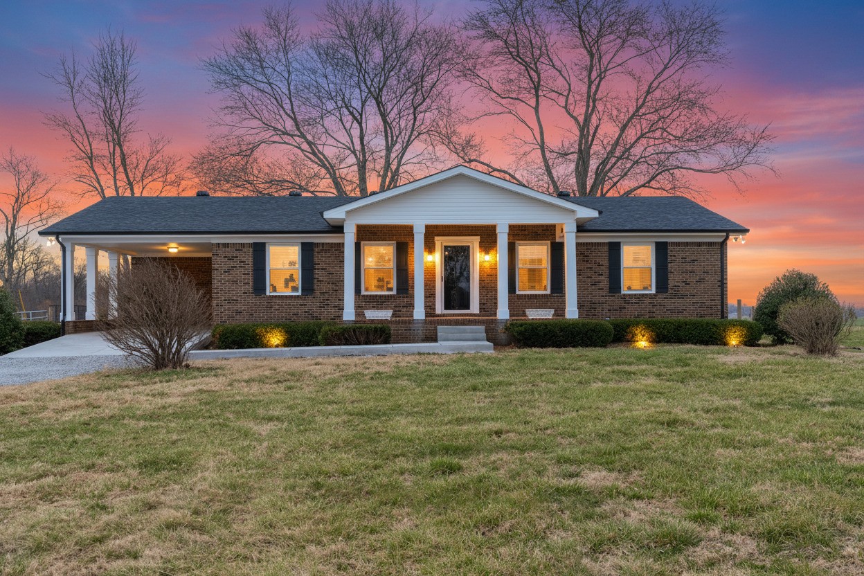 Looking for some acreage? Check out this stunning, all-brick home on 3.2 acres with breathtaking farm views, the perfect country retreat! ✨Featuring 3 bedrooms and 2.5 bathrooms, this home offers a spacious primary suite with a private bath, a large walk-in closet, plus a second closet for amazing storage. You’ll love the cozy living room and separate sitting area with fireplace, along with the beautifully remodeled kitchen showcasing butcher block countertops, a large farmhouse sink, and new stainless steel appliances.Step inside from the carport or from the patio into the huge laundry/mud room, the perfect drop zone for shoes, backpacks, and all the things after a long day.  The massive basement offers endless possibilities and includes a pool table that stays, making it ready for entertaining from day one! Enjoy grilling on the patio and fully fenced backyard ideal for pets or even small farm animals all surrounded by BEAUTIFUL farmland with no backyard neighbors. Need extra storage or workspace? The detached garage with electricity and storage building have you covered.NO HOA. NO city taxes. Just peaceful country living.Recent updates include a brand-new roof, gutters, shutters and fascia (2025), new maintenance-free flooring, new lighting, fresh paint, and more giving you peace of mind for years to come.Unbeatable location just minutes from Clarksville or Springfield near the scenic Port Royal State Historic Park where you can enjoy trail walks, fishing, kayaking and so much more!The perfect place to enjoy all that rural life has to offer and only 15 minutes outside of two major towns.