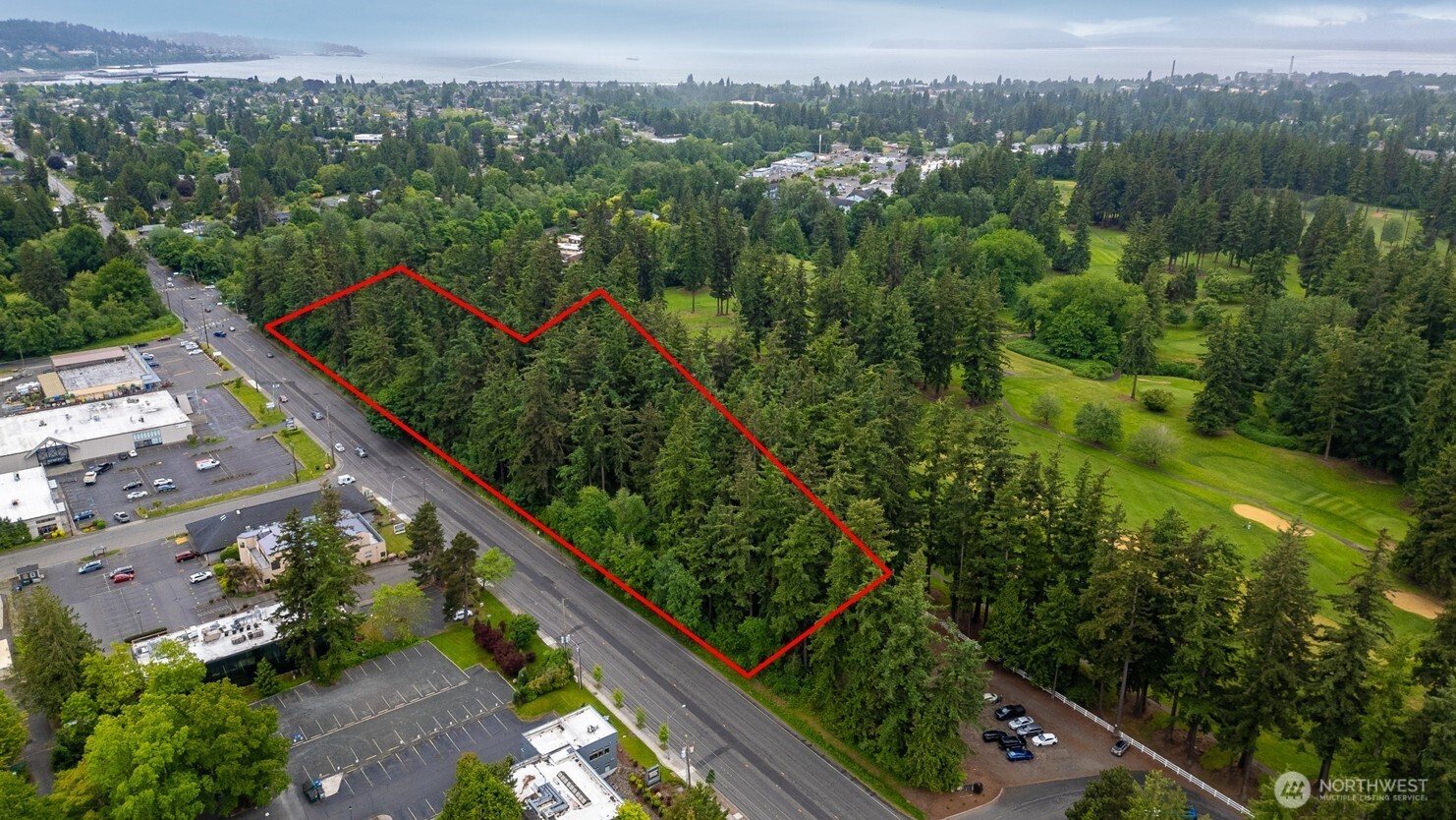 Prime development opportunity: 4.13 acres of pristine flat terrain bordering the prestigious Bellingham Golf & Country  Club. This exceptional parcel comes fully entitled for 67 townhomes with preliminary plat approval already  secured. Future residents will enjoy ideal location along 8th and 9th holes in this coveted location offering seamless  connectivity—minutes from downtown Bellingham, the revitalized waterfront district, and I-5 corridor. The property  boasts walkability to the natural sanctuary of Cornwall Park. Convenient access to existing utilities along Meridian Street.  An incredible investment opportunity in one of Bellingham's most desirable areas. The adjacent Golf Course is NOT  included in this offering.