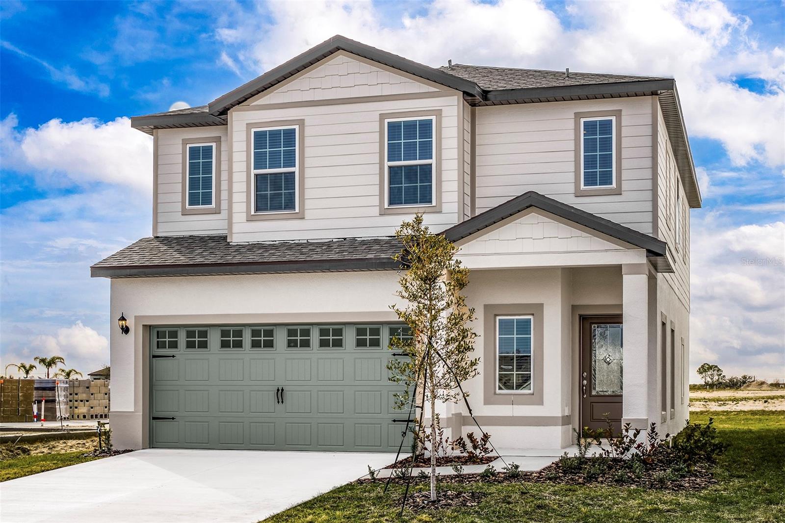 Pre-Construction. To be built. Introducing the Mangrove model at Gum Lake Preserve — a spacious two-story, four-bedroom, two-and-a-half-bath home with a two-car garage and thoughtful design throughout. This home is filled with designer upgrades and offers the perfect amount of space for your family to grow and thrive. Step inside to a grand foyer and discover an open-concept main level with an ideal layout for family gatherings. The kitchen is a true standout, featuring an expansive island with breakfast bar, exceptional counter space, and a generously sized four-shelf pantry to keep everything organized. The kitchen seamlessly flows into the family and dining areas, creating a bright, airy space perfect for entertaining. A sliding glass door leads out to the covered back lanai, blending indoor comfort with outdoor enjoyment.Upstairs, all four bedrooms are tucked away for extra privacy. The spacious loft is a flexible area that can be transformed into a home office, playroom, or media room. The luxurious master retreat easily fits a king-size bed and includes a large walk-in closet and a spa-inspired bathroom with dual vanities and a walk-in shower.Outside, enjoy a long covered front porch and beautifully landscaped front yard. Located in the desirable Gum Lake Preserve, residents enjoy access to walking trails, a community gazebo, children’s playground, fishing pier, picnic area, and a public boat ramp. Just minutes from I-4, this peaceful community offers quick access to both Orlando and Tampa, making it ideal for commuters and nature lovers alike!Don't miss out on this incredible home in a community full of amenities! Schedule your tour today!