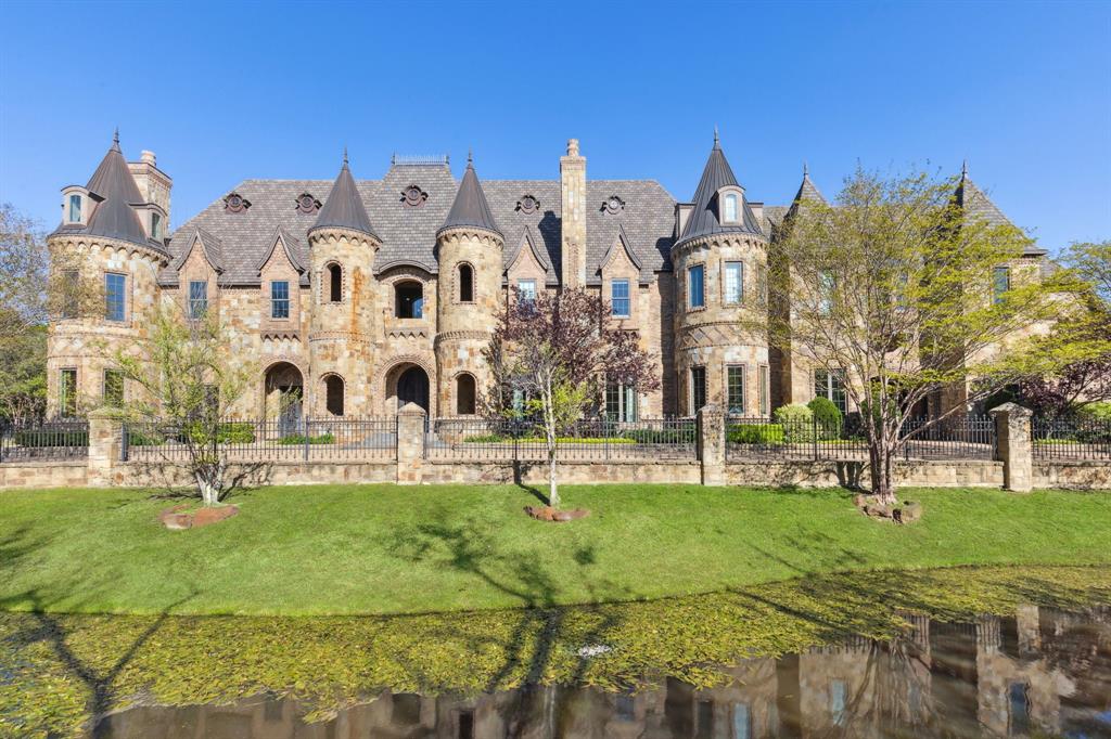 In the heart of Southlake, behind tree-lined streets and quiet prestige, stands your modern castle at 1161 La Mirada Court. Set on nearly two acres, this 13,922 sq ft estate blends grandeur with warmth and imagination. Built in 2010 and exquisitely reinvented in 2021, it showcases artisan finishes and luxe accents from Vanderpump Alain, bringing couture detail and sculptural beauty into every room. With 7 bedrooms and 12 baths, the home offers dramatic architecture balanced by inviting, intimate spaces, all within award-winning Carroll ISD. The first-floor primary suite is a serene retreat with a spa-like bath and stunning two-story boutique closet. A grotto spa and pool flow seamlessly indoors to out, creating resort-style living alongside a private tennis court and elegant 2-bedroom guest house. Every detail whispers romance—this is more than a home; it is a Southlake legacy.
