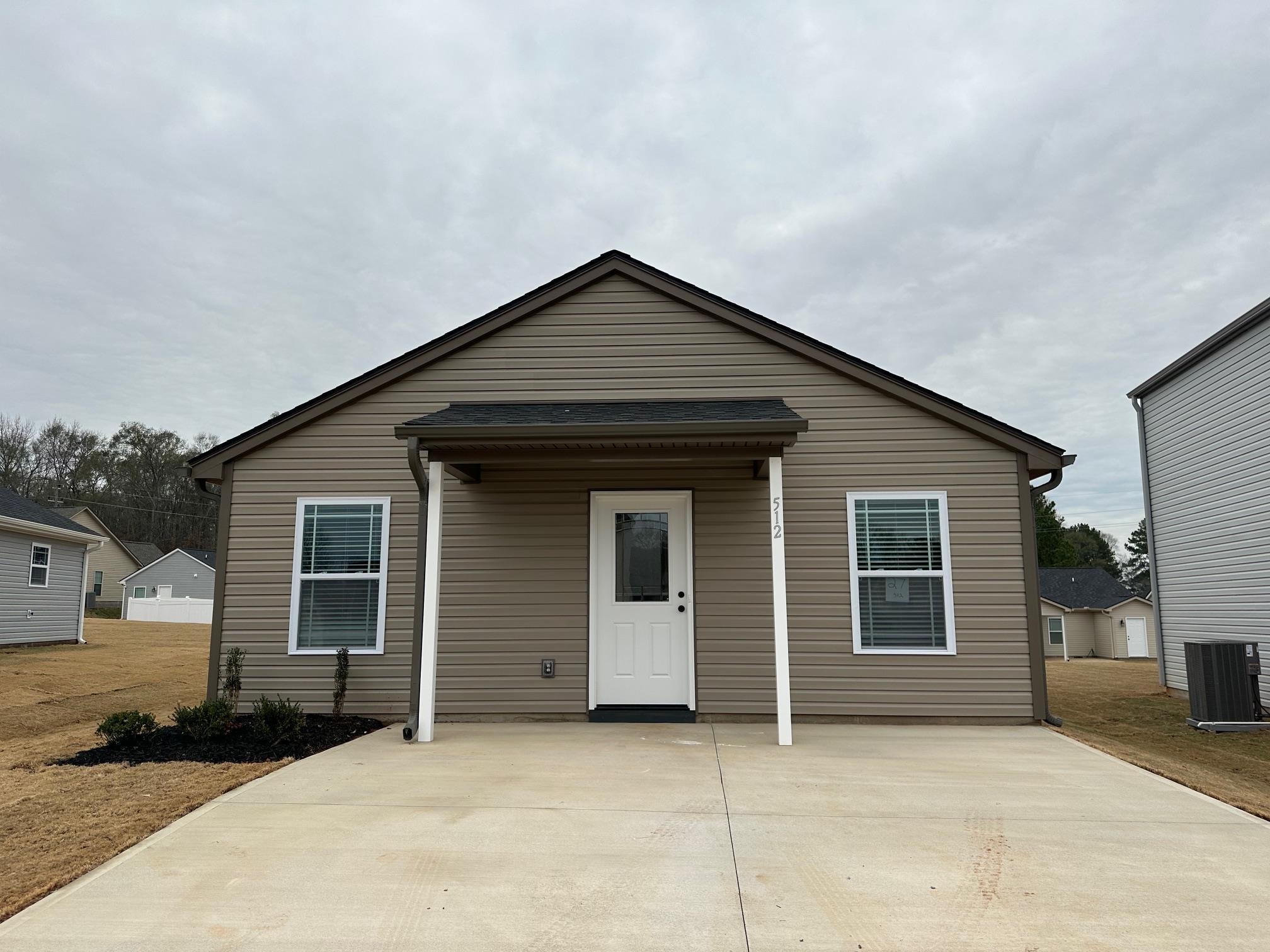 New Construction by local builder located in Spartanburg! The Elliott floor plan is a 2 Bedroom, 2 Bath, single story home. Standard features include Walk in Laundry, Luxury vinyl plank flooring in kitchen, dining and wet areas, Concrete back patio, and fully sodded yard. Great opportunity at a great price! Must See! Lot 62 - Elliott Plan. Ask about $7,500 Builder Incentive!