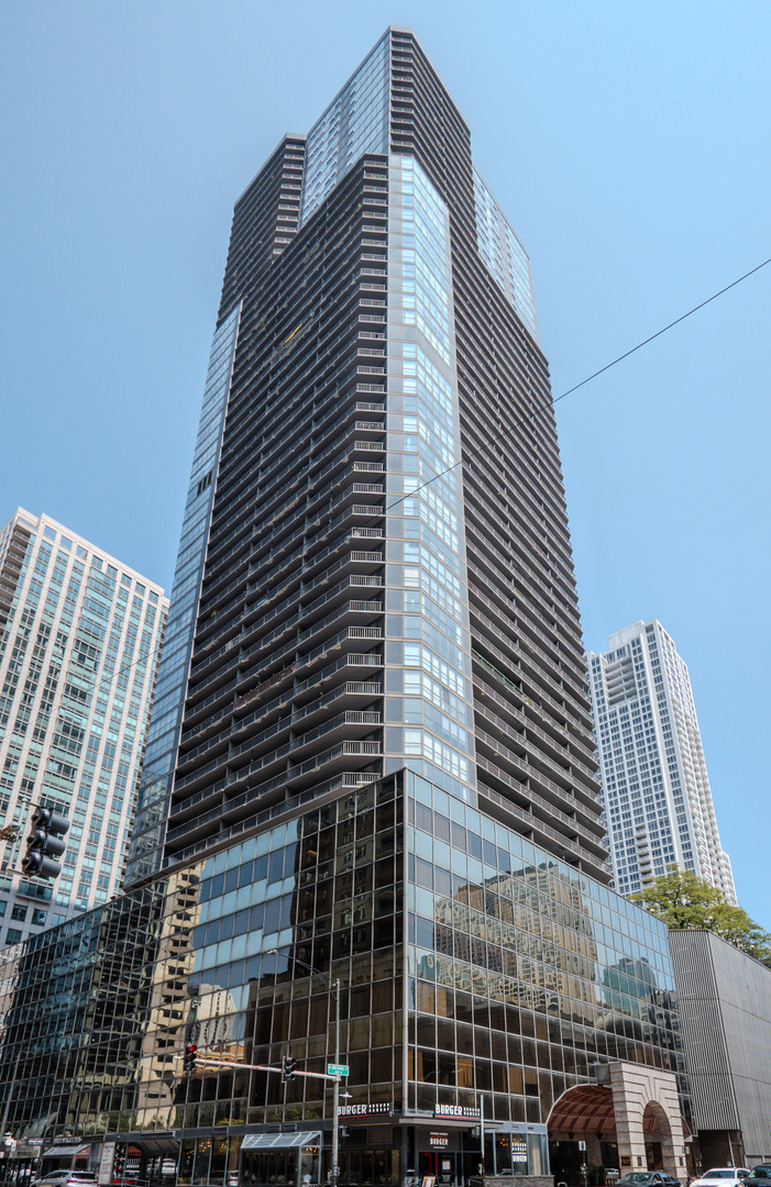 This is the one you've been waiting for! Spacious and Upgraded, this NorthWest corner One-bedroom, nearly 1,000 sq. ft., is perfectly located in the heart of River North. Bright and airy, the unit features Floor-to-Ceiling windows with city views and a massive private balcony, perfect for morning coffee or evening relaxation. The Open-concept layout includes a Modern Kitchen with White cabinetry, New hardware, Granite Countertops, a Breakfast Bar, and ample storage, along with Brand-New SS Appliances including a Range, Dishwasher, and Refrigerator with icemaker. The Living and Dining areas showcase high-end wood laminate flooring and provide abundant space for both casual living and formal entertaining. The Large Bedroom is filled with natural light from a wall of windows and offers generous closet space. Full Bathroom w/ sleek vanity, and  tub/shower completes this unit. Freshly painted throughout including baseboards, the unit also provides smart storage solutions for a clutter-free lifestyle.  Washer/Dryer installations are NOW ALLOWED in the building. Deeded parking is available for $20K, Investor-friendly with no rental cap and Pet Friendly. Ontario Place offers resort-style amenities including 24-hour door staff, a private outdoor park, pool, indoor spa, expansive fitness center, sauna, business center, newly renovated community/conference room, on-site management, and a live-in engineer, ensuring worry-free city living. All this is just steps from Michigan Avenue shopping, Whole Foods, Eataly, Quartino, premier dining, and vibrant nightlife, with convenient access to I-90/94 for effortless commuting.