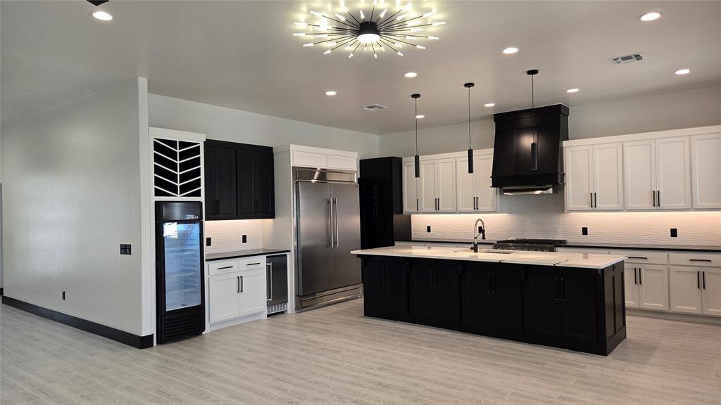 This exceptional upscale modern design new home offers a blend of luxury and functionality, featuring: Custom Cabinets: Tailored cabinetry that enhances both style and storage along with a study. Forno Appliances: Equipped with Forno's Italian-inspired, professional-grade appliances, the kitchen. Ice maker to make entraining much easier. Space-Saver Microwave: A built-in microwave designed. '60 Refrigerator and the tall Beverage Refrigerator and Marble Countertops with Backsplash: High-quality stone countertops complemented by a matching backsplash, offering durability and timeless beauty. Garage Door Opener with Keypad: An automated garage door system featuring a convenient keypad entry. 2" Blinds on All Windows (Excluding Obscured Glass) High-Efficiency 16 SEER Central Air-Conditioning: A 16 SEER central air-conditioning system that provides superior comfort and energy efficiency, ensuring a cool and comfortable living environment. Fully Sodded Yard: A professionally landscaped yard with lush sod, creating an inviting outdoor space ready for enjoyment. Along with covered patio so you can enjoy mornings or evenings comfortability including the gas stub. A retractable backdoor that seamlessly connects indoor and outdoor living areas, perfect for entertaining and enjoying the outdoors. Electric Fireplace: A modern electric fireplace that adds warmth and ambiance to the living space without the maintenance of traditional wood-burning options. Exhaust Vent to the Exterior: An exhaust system that directs air outside, maintaining indoor air quality and comfort. This home is thoughtfully designed to offer a harmonious blend of luxury, functionality, and modern living. Home is waiting for the 1st Owner so you can pick the carpet/flooring for the bedrooms and study. Home is just minutes of I-35 or going East to I-240. Community has a pool and recreational center.  **Tax Amount on land only**