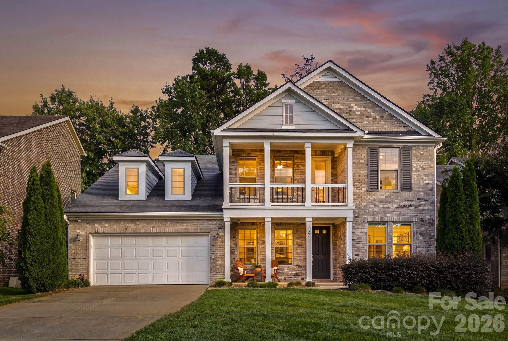 Welcome to 127 Smithfield Drive, a beautifully maintained home that strikes the perfect balance between style, comfort and everyday livability. From the moment you enter, this gorgeous home makes an impression. The two-story great room with soaring ceilings an inviting fireplace and an abundance of natural light, is the heart of the home. A full-home generator adds an extra layer of comfort and peace of mind, while the open layout makes the main level feel spacious and connected, whether you're enjoying a quiet evening at home or entertaining friends and family.The kitchen is designed for the way people live today, with a large island, generous cabinetry and counter space, stainless steel appliances and a spacious pantry. Just beyond, the main-level primary suite offers a peaceful retreat with a beautiful spa-inspired bath and large walk-in closet which leads to the laundry room. A first floor den, dining room and office nook/butler's pantry round out the main living space.Upstairs, three additional bedrooms and a versatile loft provide plenty of room for family, guests, an office or whatever life calls for. A second-floor balcony adds a special outdoor space overlooking the neighborhood—perfect for stepping outside and enjoying a little fresh air without leaving home. The screened-in porch extends the main floor living space beautifully and is just the spot for morning coffee, an evening glass of wine or relaxed weekend gatherings. The meticulous care make this a home you can simply move in and enjoy.  And the location is exceptional—just minutes from Charlotte's private schools, SouthPark's shopping and dining and the boutiques and restaurants of Downtown Matthews. Beautifully situated, thoughtfully designed and easy to live in, 127 Smithfield Drive is the kind of home that feels welcoming from the minute you enter.