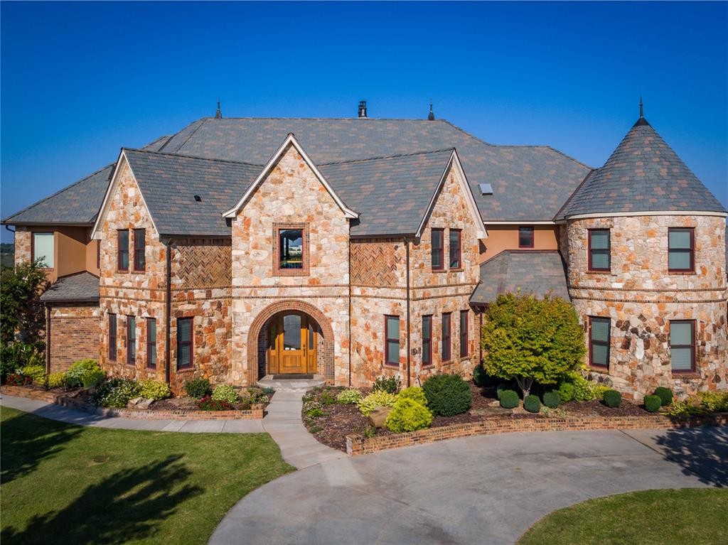 May be eligible for VA loan assumption at 2.25%Flexible floor plan ideal for multigenerational living!Prepare to be captivated by this remarkable estate that seamlessly combines functionality, design, & craftsmanship. From the top of a 4-story observatory tower, enjoy breathtaking Edmond to Oklahoma City skyline views. Featuring solid quarter-sawn white oak doors, floors & trim throughout. A 2-story great room showcases soaring ceilings & French doors opening to a suspended terrace with stunning views.The primary suite offers a private balcony, double shower & Jacuzzi tub. Bedrooms feature recently updated carpet, adding fresh comfort throughout the home. Relax in an outdoor oasis with a newly re-plastered & tiled pool, palm trees & poolside restroom. Evenings invite gathering around the outdoor fireplace for unforgettable moments.Completed walk-out basement with mini kitchen, offering a private living area. Energy efficiency is enhanced with spray foam insulation, a synthetic slate roof, three new water heaters, & geothermal heating/cooling systems.Additional amenities include home theater, 3-story elevator, gym, two offices, large workshop with open upper story storage, recently updated kitchen appliances & ample space for building horse housing. Feel secure with a walk-in basement storm shelter/safe room & generator hook-up.Situated on 5.1 prime acres just off I-35, this property offers exceptional privacy while remaining easily accessible.Listing Realtor is related to seller. OREC #200109