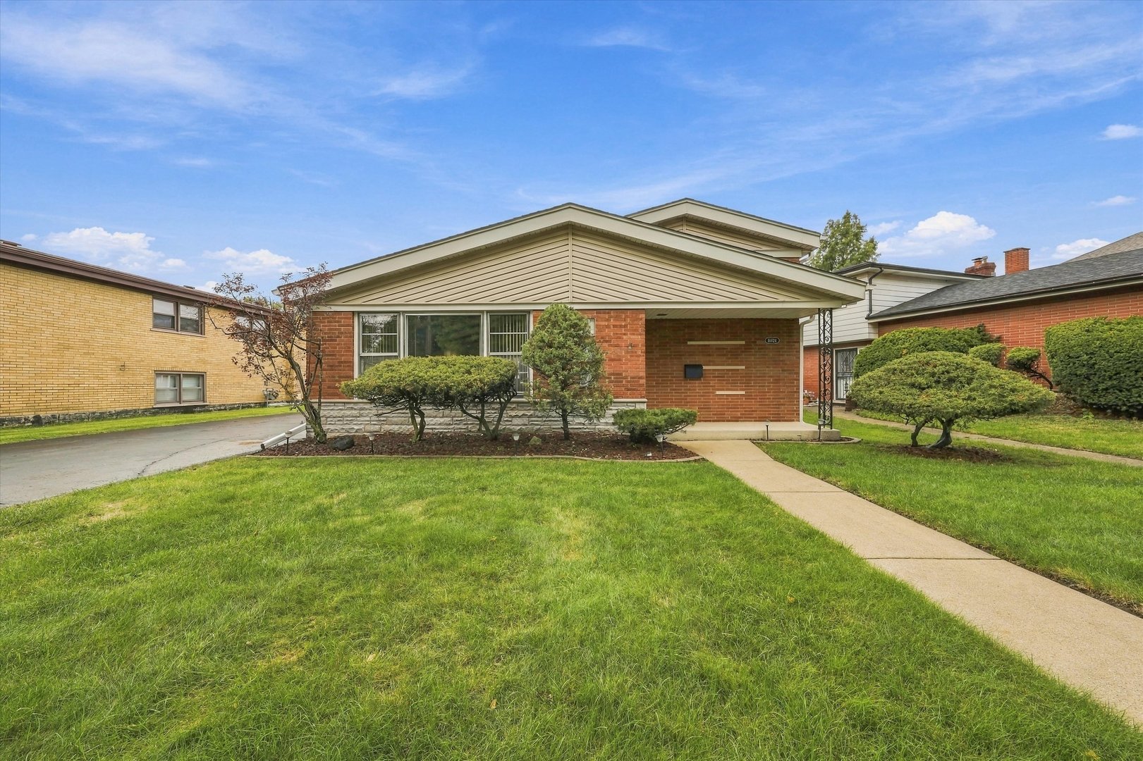 Excellent buy on this oversized all brick split level home in the heart of Oak Lawn. The eat in kitchen boasting stainless appliances flow into huge living room which are accented with beautiful vaulting ceilings.Upstairs you will find 3 spacious  bedrooms and full updated bath.Entertain family and friends in the large family room with a electric fireplace.There is hardwood floors under all of the home.Nice size 2.5 car garage with a large deck behind it. Glass will be replaced on sliding door in garage before closing.Refeigerator one year old.Air conditioner 6 years old.Furnace installed in 2017. This is truly a great home that has been well taken care of by the owner.