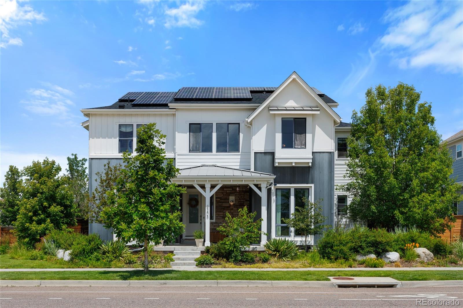 Welcome home to a truly one of a kind property where old-world artistry & modern living converge to create an unforgettable family home, perfectly situated in Denver’s highly sought-after Central Park neighborhood. Nearly every inch of this timeless home has been transformed from builder grade to artisan design, with natural finishes at every turn - European inspired stone kitchen, cobblestone bathroom & laundry room floors, lime washed walls, reclaimed wood beams, unlaquered brass fixtures & the list goes on. Step off the inviting covered front porch into a bright, open-concept main level featuring gorgeous hardwood floors and an elevated kitchen complete with premium appliances, quartz countertops, coffee nook, double dishwashers and a large center island that flows seamlessly into a cozy, fireplace-anchored living space. Upstairs, a luxurious primary suite with vintage fir beams awaits with a massive walk-in closet and a spa-like en-suite bath, accompanied by generously sized secondary bedrooms ideal for family or a home office. The fully finished basement offers incredible versatile bonus space for a home theater, gym, or guest suite, while the professionally landscaped backyard and private patio are tailor-made for Colorado summer evenings, including a backyard creek for both kids & adults to enjoy. Complete with a spacious two-car garage and located just a short stroll from Target, community pools, endless restaurants, winding trails, and award-winning schools, this exceptional home delivers an unbeatable lifestyle with effortless access to downtown Denver and DIA, with Whole Foods, Trader Joe’s & Lifetime Fitness all coming soon in walking distance as well. 8205 E. Prairie Meadow drive is a soulful home offering a palpable warmth with a masterful blend of timeless craftsmanship and refined modern living! Notes: Solar is owned not leased, roof was recently replaced and the majority of the items in the home are negotiable.