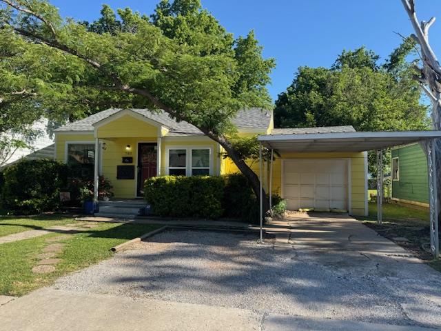 Quaint yellow house on a large lot with mature trees and established love in Central Norman.  Convenient location just north of Main Street and west of Flood Ave for anyone commuting east to downtown Norman, south to the University of Oklahoma or north to Oklahoma City. Recent Oklahoma storms brought exterior improvements to the veneer siding, new carport, new roof, new windows and two new mini-split AC units.  The home features central heat, step down converted garage off the kitchen with washer/dryer hook ups, and wooden floors beneath the carpeted areas in the living, hallway and bedrooms.  Brand new gas hot water tank just added 2026.  Exterior Big Ticket items are complete making way for the new owner to customize the interior at their own pace.  Large, fully shaded and fenced backyard with alley access. Owner selling AS IS CONDITION.