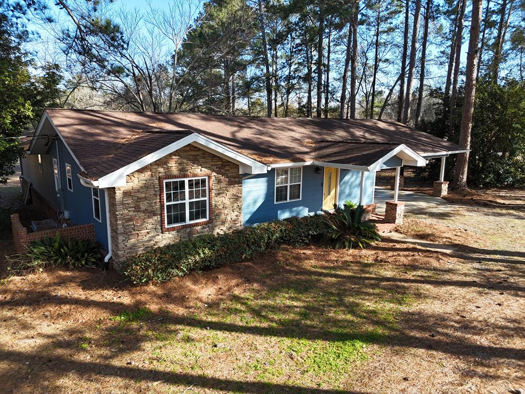 Experience country elegance on 5 sprawling acres with this inviting 3-bedroom, 2-bath farmhouse. Thoughtfully designed for both comfort and functionality, the property features a workshop, chicken coop, and a dedicated garden area. Step onto the expansive back patio and take in serene, open-acre views—perfect for relaxing or entertaining. Livestock are welcome, blending rustic charm with modern convenience. Just a few miles from town, this property offers the perfect balance of peaceful rural living and accessibility. For virtual tour click here: https://my.matterport.com/show/?m=Zt4ufGVVNhe&mls=1