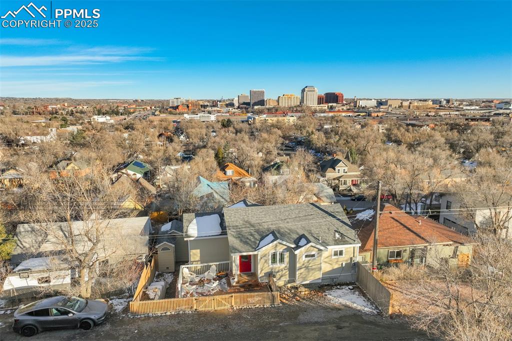 Tucked into the west side of Colorado Springs, this historic home is 100% organic & locally sourced. It’s got the perfect mix of old-school charm and modern flair. The main level has soaring Cathedral-like ceilings, wood floors, custom built-ins, and great city & mountain views throughout. The kitchen is updated with stone countertops, great pantry space, and the perfect window over the sink that looks out to the mountains. A large living room, two bedrooms, and a bathroom complete the main level. Downstairs, you’ll find the finished walk-out basement that’s so nice, you might forget to come back up. It’s got its own entrance, a family room, two more bedrooms, and a full remodeled bath—perfect for guests, in-laws, or that one friend who “just needs a place for a few weeks.” From the upper deck, the sunsets are so good, you'll post to Instagram at least once a week. The lower patio offers more hangout space and a huge storage shed for all your gear. Reinforced concrete retaining walls, new fencing, and a hookups for an electric vehicle, are just a few of the upgrades done to the exterior. And if you’re lucky, a deer might wander by to remind you that yes, you do in fact live in a postcard. This west-side wonder is part history, part luxury, and entirely too good to pass up. Whether you’re looking for a forever home, an income suite, or just a place to impress your friends with your “mountain lifestyle,” this house delivers. It’s got views, vibes, and just enough quirk to keep things interesting—like Colorado itself.