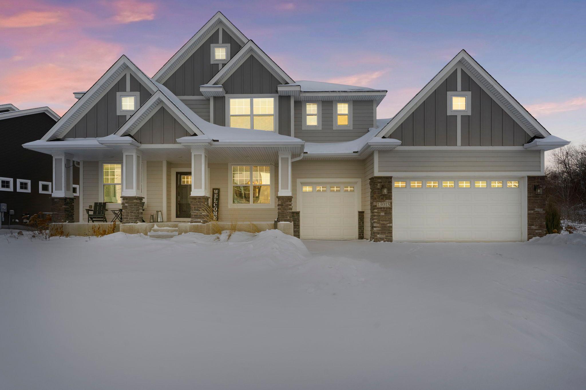 Welcome to this stunning five-bedroom, five-bathroom home in the desirable Bella Vista neighborhood, set at the end of a quiet cul-de-sac with no neighboring home on the right, offering exceptional privacy and impressive curb appeal. Just steps from a park, fishing pond with dock, and scenic biking and walking trails, this home is located in the award-winning District 196 school district and minutes from shopping, dining, and entertainment. The light-filled kitchen features a modern design with abundant cabinetry, an oversized center island with breakfast bar seating, pendant lighting, stainless steel appliances, and a walk-in pantry. Luxury plank flooring flows into the informal dining area with access to a spacious, maintenance-free deck, perfect for indoor-outdoor entertaining. The main level also includes a formal dining room, cozy living room with gas fireplace, front-facing office with French doors, convenient half bathroom, and a functional mudroom with built-ins off the heated three-car garage with epoxy floors, floor drains, and utility sink. The upper level offers four spacious bedrooms, including a private primary suite with tray ceiling, large walk-in closet, and ensuite bathroom with double vanity, tiled walk-in shower, and separate water closet. A laundry room, oversized loft, and well-appointed bathrooms complete this level. The lower level is designed for entertaining with a family room, gas fireplace, recreation space, and wet bar. Bedroom five, a three-quarter bathroom with soaking tub and heated floors, ample storage, and unfinished space complete this level. A beautifully maintained, move-in-ready home in an exceptional location.