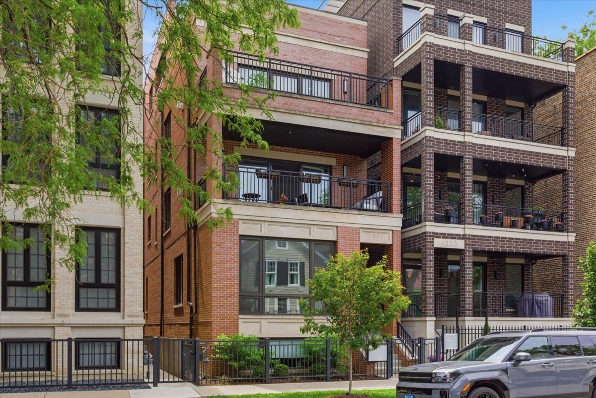 Welcome to Lincoln Park and this rare duplex-up penthouse condo on historic Wrightwood! This all-brick building benefits from an up-zoned status which allows for a bigger and wider footprint than expected. This home is truly a gem and features quality craftsmanship and luxury finishes that surpasses most new construction. The main level has a beautiful custom kitchen, living/dining space, the primary suite, and a 2nd bedroom and full bathroom.  The open layout includes a chef's kitchen with high-end appliances, double oven, quartz counter tops, beverage fridge, and breakfast bar that is connected to a spacious living and dining room with gorgeous built-ins surrounding the gas fireplace. The living room flows out to a charming front balcony overlooking Wrightwood, great for convenient grilling! The primary suite features a walk-in closet and en-suite primary bathroom with heated floors, high end tiling, double vanity, walk-in shower and free-standing tub. The second floor has a large family room, with another beverage fridge and wet bar, a 3rd bedroom and 3rd full bathroom, and walks out to an expansive roof deck that overlooks the tree-lined street (not the alley) and has a built-in double sided gas fireplace! Part of the roof deck is fully covered and features speakers, lighting and option for ceiling fan; the other half is uncovered and perfect for you and your city garden to soak in the sunlight! Additional finishes include 8' doors, oak hardwood flooring thru throughout, surround sound, an enclosed back staircase leading to the garage space (included in the price), and a private storage room (~4'x7').  This amazing Lincoln Park location is close to countless dining, shopping and nightlife on Wrightwood Ave and nearby Southport!