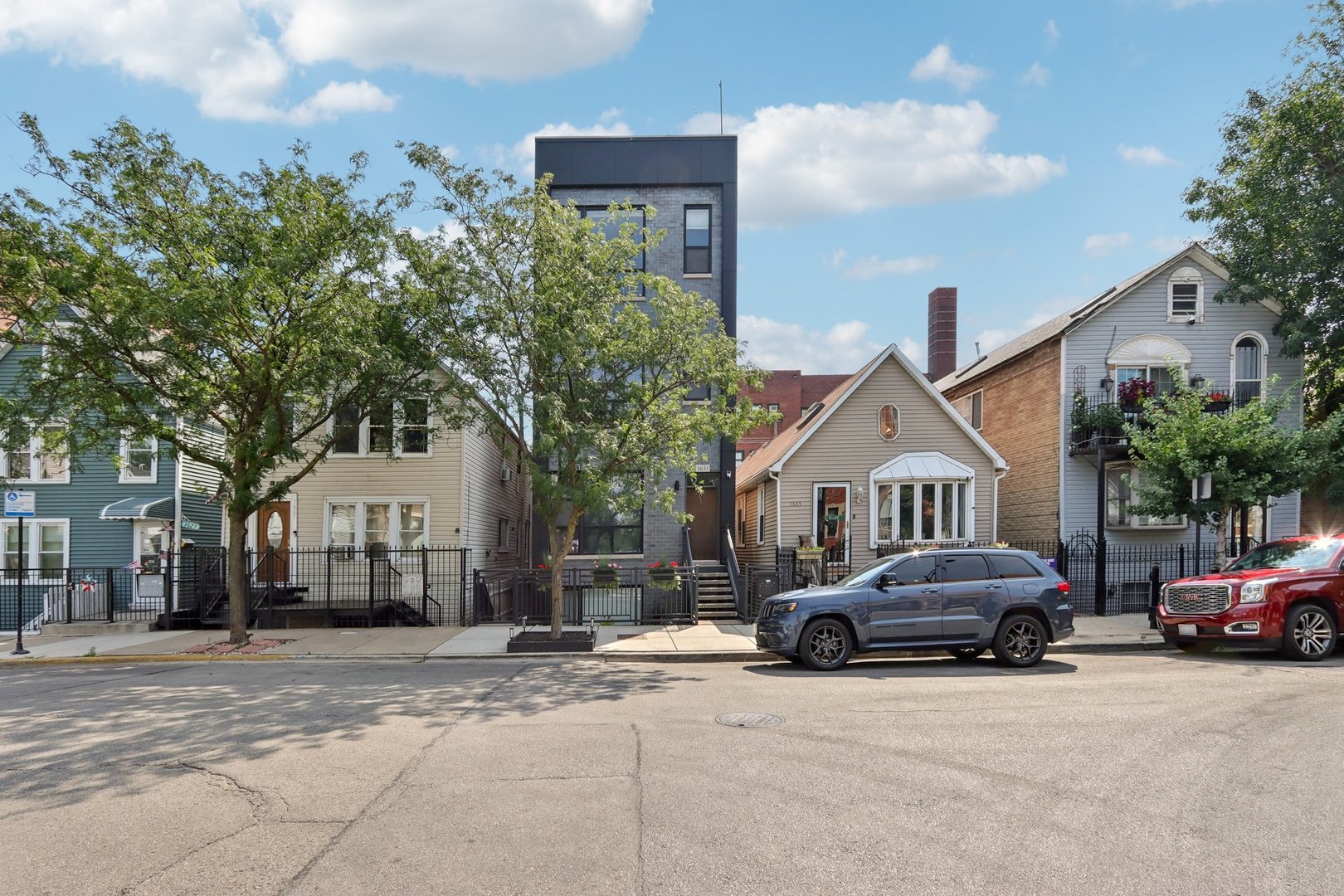 Top-Floor 2BD/2BA Condo with Private Rooftop & Skyline Views - Prime Pilsen Location.  Sun-filled west-facing condo built in 2020 with floor-to-ceiling windows and open-concept living. Modern kitchen features quartz countertops, ample cabinet space, dishwasher, microwave, and disposal. Interior staircase leads to an expansive private rooftop deck spanning the entire building, offering panoramic city skyline and treetop views. Primary suite includes a walk-in closet, rear private balcony, and ensuite bath with double vanity. Second bedroom ideal for guest room or office. One parking space included. Steps to 18th Street dining, cafes, shops, galleries, National Museum of Mexican Art, and Pink Line.