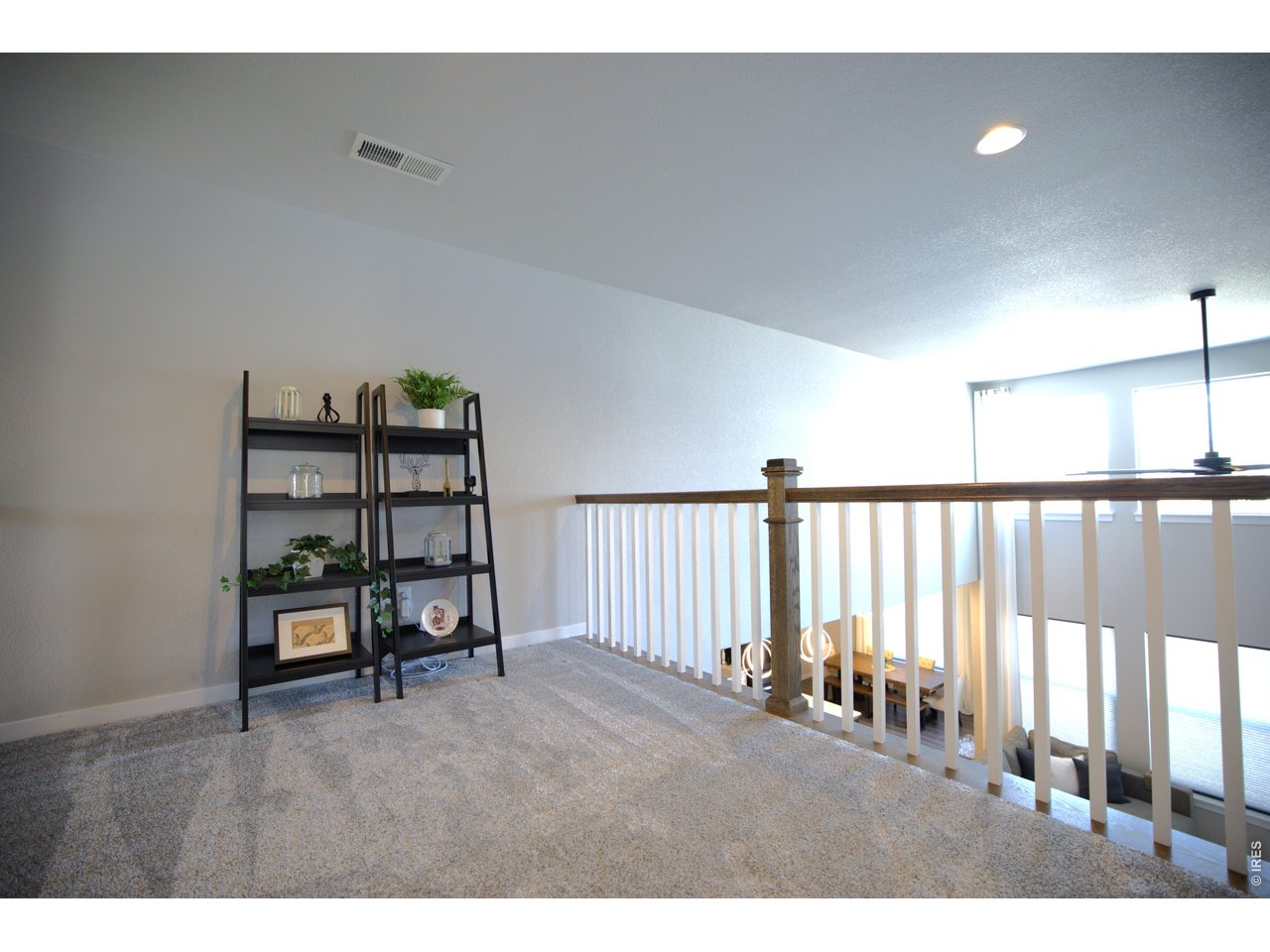 If you are looking for a ranch style layout with extra space, this home is a must see! Located in the highly sought after RainDance community, this beautifully finished home offers the ease of main level living with the added flexibility of a two story design. Two bedrooms are located on the main floor, including a spacious primary suite.This 4 bedroom, 3 bath home features an open and inviting floor plan with soaring ceilings, LVP flooring, and a cozy gas fireplace with designer tile. The kitchen shines with quartz countertops, stainless steel appliances, white cabinetry, and a generous walk in pantry.The main floor primary suite includes a luxurious five piece bath with double vanities and a large walk in closet. An additional bedroom, full bath, and a spacious laundry room complete the main level. Upstairs you will find a versatile loft that connects two bedrooms with walk in closets and a convenient Jack and Jill bathroom.The unfinished, insulated basement offers excellent potential for future expansion. Separate HVAC systems for the upper and lower levels provide year round comfort and efficiency.The fully landscaped backyard features an extended patio and outdoor lighting, perfect for relaxing or entertaining. A doggie door with steps adds convenience for pets, and the three car garage with durable epoxy floors provides both function and style.Enjoy the RainDance lifestyle with scenic trails, parks, a resort style pool with lazy river, golf, dining, playgrounds, and top rated schools. Just minutes from Hoedown Hill for tubing and skiing.Skip the wait and added expense of new construction. This home is move in ready and available for possession in as little as two weeks. Bonus, lender offering a 1% credit of the loan amount toward closing costs and prepaids for approved borrowers.
