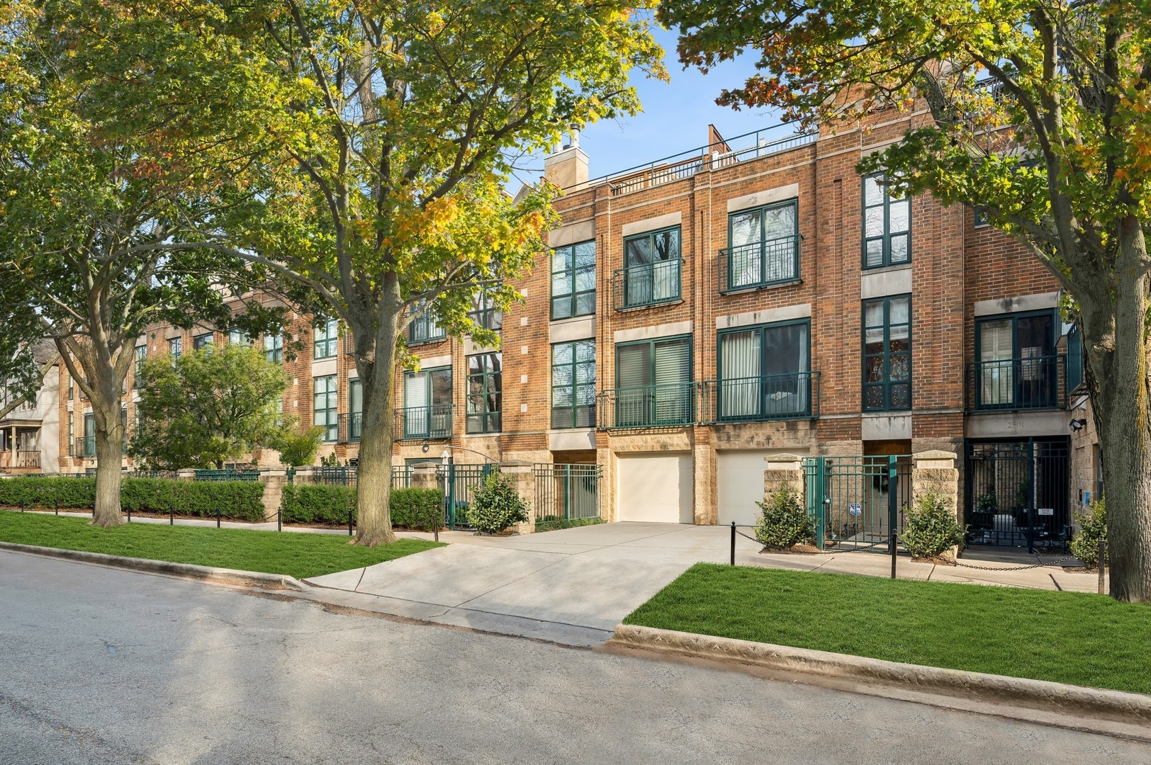Experience this bright and welcoming 3-bedroom, 2.5-bathroom townhome in a charming residential pocket of Lincoln Park, ideally located near the neighborhood's most desirable amenities and within the highly rated Oscar Mayer school district. The entry level features a comfortable living room and a convenient half bath, offering a flexible space for a media room, home office, or casual entertaining. Upstairs, the main level boasts expansive floor-to ceiling windows that fill the space with natural light, an open-concept layout with a cozy fireplace, a designated dining area, and a gourmet eat-in kitchen-perfect for both everyday living and hosting guests. The third level includes all three bedrooms, including a primary suite with custom closets and a luxurious marble bath, along with a beautifully updated second full bathroom that services the other bedrooms. A unique feature of this home is the custom glass-enclosed office added by the sellers on the top floor-designed to block out sound while providing a quiet, private workspace. This stylish space leads directly to a spacious rooftop deck, ideal for relaxing, working, or entertaining outdoors. Additional highlights include a private 15x20 patio, rich dark-stained hardwood floors throughout, in-unit laundry, and a 1-car attached garage, all within a boutique, gated community. Perfectly positioned near Lincoln Park's best, you're just moments from the Lake Shore Athletic Club, dining at Avli Taverna, cocktails at Love Street, wings at Bird's Nest, and curated finds at Punt & Plume. With top-rated schools, parks, shopping, and dining just steps away, this home offers the perfect blend of comfort, functionality, and location.