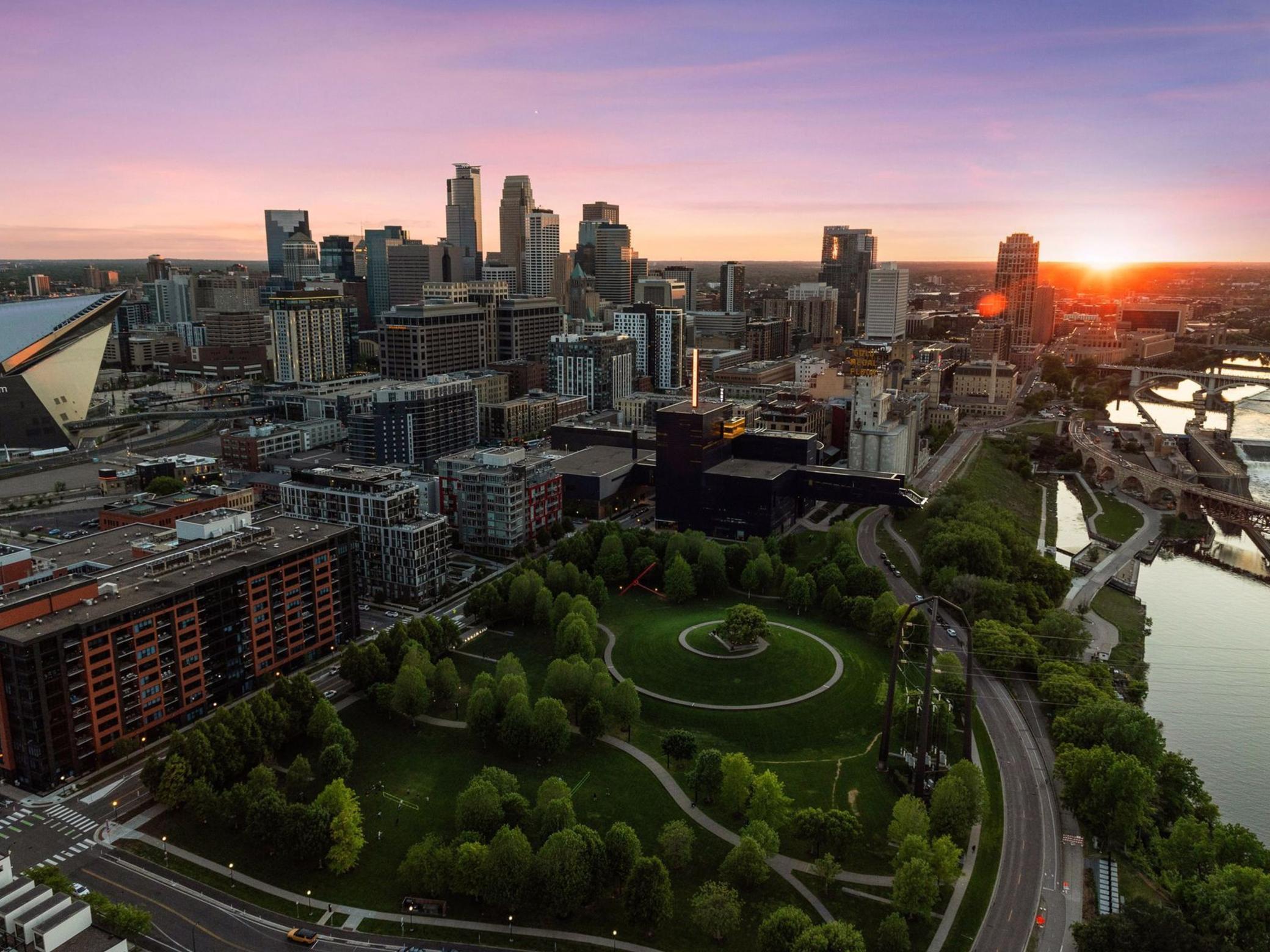 Welcome to ELEVEN, the first residential condominium tower in the heart of downtown Minneapolis by renowned Robert A.M. Stern Architects. Ideally positioned on the northwest corner of the building, this beautifully designed two-bedroom, three-bath residence offers extraordinary panoramic views of the Mississippi River, downtown skyline, U.S. Bank Stadium, Gold Medal Park, and the iconic Stone Arch Bridge. From sunrise to sunset, the vistas are among the finest in the city. Timeless architecture meets refined luxury with expansive floor-to-ceiling windows that fill the home with natural light.The open-concept layout is anchored by a chef’s kitchen featuring white oak cabinetry, quartz countertops, Wolf and Sub-Zero appliances, and an oversized center island ideal for entertaining. The kitchen flows seamlessly into the dining area with both west and north-facing views. The elegant great room is highlighted by a gas-burning fireplace with custom built-ins.The spacious primary suite is a true retreat with a spa-like marble bath, soaking tub, separate shower, heated floors, and a generous walk-in center-island closet. An adjacent private office provides an ideal space for reading or working from home.The residence also includes a second bedroom with ensuite bath and a spacious media room that could easily convert to a third bedroom if desired. A 273-square-foot heated, covered terrace extends the living space and offers front-row riverfront views.Completing the home are a laundry room, stunning powder bath, and abundant storage. Additional features include ten-foot ceilings, oak hardwood floors, enameled woodwork, Sonos speakers, Lutron lighting, eight-foot paneled doors, built-in storage, and two heated garage stalls.ELEVEN offers an unmatched lifestyle with 24/7 concierge and doorman service, resort-caliber amenities, available guest suites, and walkability to parks, trails, acclaimed restaurants, shopping, and theaters. A rare opportunity to own one of Minneapolis’ finest condominiums.