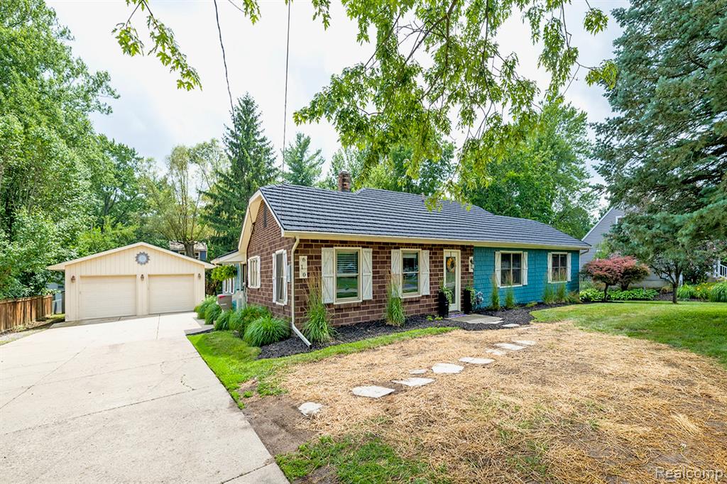 This beautiful, move-in ready, home sits on a double lot within walking distance of all 3 Williamston schools. There is a large Trex deck to enjoy the backyard that is surrounded by mature trees, a fence and even a tree fort! Inside are vaulted ceilings in the family room, primary bedroom and the 2nd bedroom offering an open, spacious feel. The living room boasts a cove ceiling for added charm. The primary bedroom includes a fireplace, walk-in closet and an office. Multiple updates make this home low maintenance for years to come. In 2023 a new furnace, air conditioner, water softener and washer and dryer were installed. A brand new decorative metal roof was installed in 2024. The garage boasts 864 square feet offering plenty of room for 2 cars and storage or a workshop. A must see!