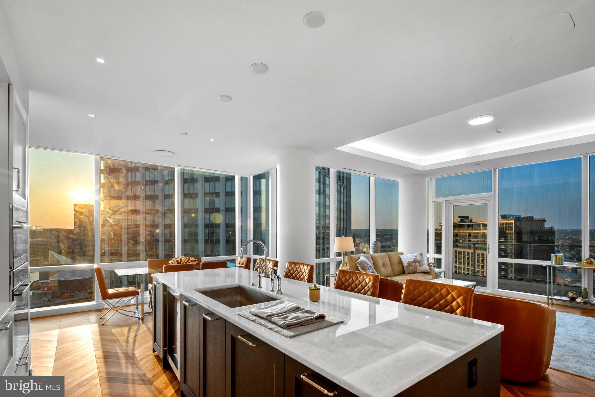 Breathtaking Panoramic views of the Inner Harbor from the most Luxurious Building, located in the most coveted Zip Code in Baltimore City, the Four Seasons Private Residences in Harbor East. This 2 Bedroom 2 Bathroom Residence, located on the 23rd Floor, features an inviting Open Floor Plan with sprawling Chevron Walnut Wood Floors throughout and floor to ceiling windows in every room to ensure maximum exposure to sunlight and gorgeous views. The Custom gourmet Kitchen is perfectly appointed with Miele appliances and centered around an elegant waterfall marble countertop island that is open to the living space which includes an outdoor Patio where the dramatic views continue. The Primary suite is complete with dressing room and lavish en-suite marble bath w/ large walk-in shower and stand-alone soaking tub. Four Seasons 5-Star Amenities include a Residence Only front entrance and resident only amenities level which encompasses the entire 28th floor and the views continue. This private resident level includes an infinity edged Salt Water indoor heated pool with an open air rooftop Sundeck, a Sauna - complete with its own Harbor Views, fitness room, a large gathering and event space which consists of large dining area, lounge spaces, conference room, billiard area, kitchen space, indoor and outdoor fireplaces, multiple outdoor seating spaces, outdoor grilling area, and an outdoor AstroTurf dog walking space. Four Seasons Private Residences Baltimore, a seamless blend of sophisticated style, lavish amenities, and the exemplary service of the world's preeminent hotelier. *Photos are of another staged similar Residence and current furnishings may be different.