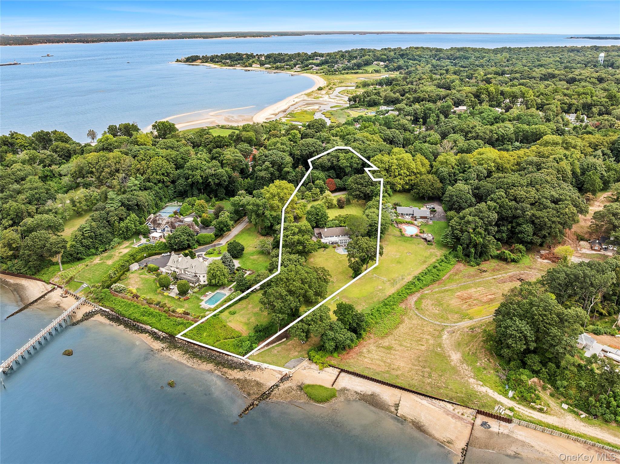 Built in 1924, this home was originally the carriage house to a former Gilded Age Gold Coast estate called Deephaven which occupied the entire cul-de-sac and was entered through the  wrought iron gates still in place today.  Sited to take advantage of expansive LI Sound and NY City skyline views.This is a rare opportunity to reimagine the existing structure or to build the home of your dreams.