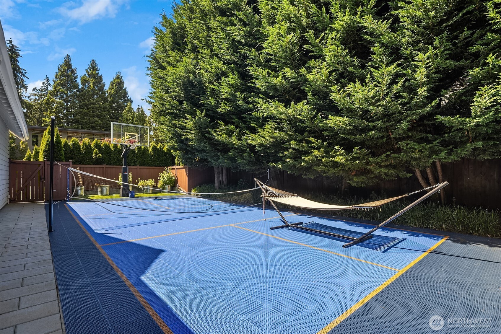 Multi-sport court doubles as a hangout spot with a shaded hammock