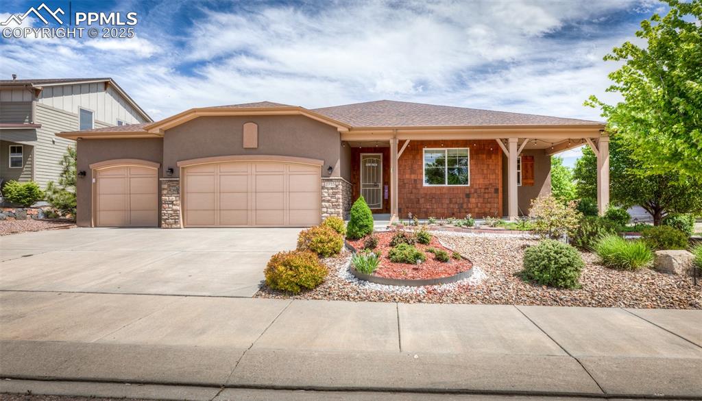 This exceptional like new 4258 sq ft 4 bedroom, 3 bath rancher sits on a .23 acre fully xeriscaped corner lot backing to open space ~ 3 car insulated & finished garage ~ 2x6 construction with xinsulation ~ A/C ~ Gas log fireplace ~ travertine counters in all baths & gourmet slab granite kitchen with Bosch stainless steel upgraded appliances, including gas range ~ Open "Great Room" one level living open concept floor plan ~ Engineered hardwood flooring thru-out main living area ~ 9' ceilings on main level ~ Security system ~ Custom lighting, solar tubes, iron railings ~ Barn door in 5 piece primary bathroom ~ Custom tile work & hand troweled walls ~ high efficiency furnace ~ 50 gallon hot water heater ~ CONSTRUCTED WITH ALL AMERICAN MADE PRODUCTS ~ just professionally cleaned to include carpeting ~ nothing to do but move in ~ perfect 1 level living with everything you need on one level