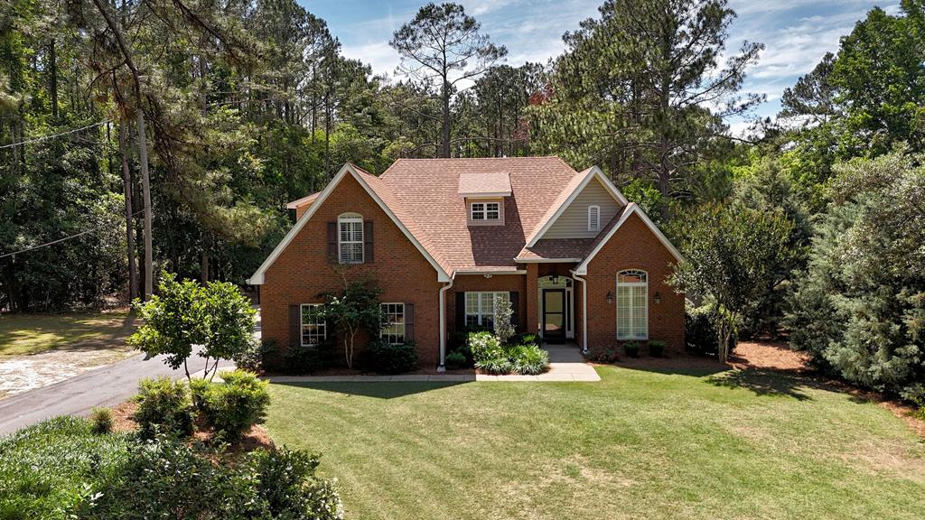 Nestled among the peaceful beauty of South Georgia, this stunning property on Gatlin Creek Road offers the perfect blend of privacy, charm, and country living. From the moment you arrive, you'll feel the sense of space, serenity, and a home that makes this property truly special. Downstairs features a flex room, formal dining, large living, open kitchen and breakfast nook. The half bath is located by the laundry room that has built in features. Located on the back of the home is the spacious master bedroom. It has an on suite bath that has double vanities, granite countertops, glass shower, free standing tub and tile flooring. The beautiful iron and wood staircase is a show stopper. Upstairs you will find three additional bedrooms and a full bath. Whether you're entertaining guests, enjoying quiet mornings, or simply taking in the natural surroundings, this home delivers timeless elegance with modern convenience — all just minutes from the heart of Thomasville. The back yard is fenced in for added privacy. In addition to the two car garge is a storage building that matches the main house that includes plenty of space for extra vehicles or a workshop. In addition to all of the features, this property is wired and ready for you to install a generator. Properties like this don't come along often. Schedule a showing today.
