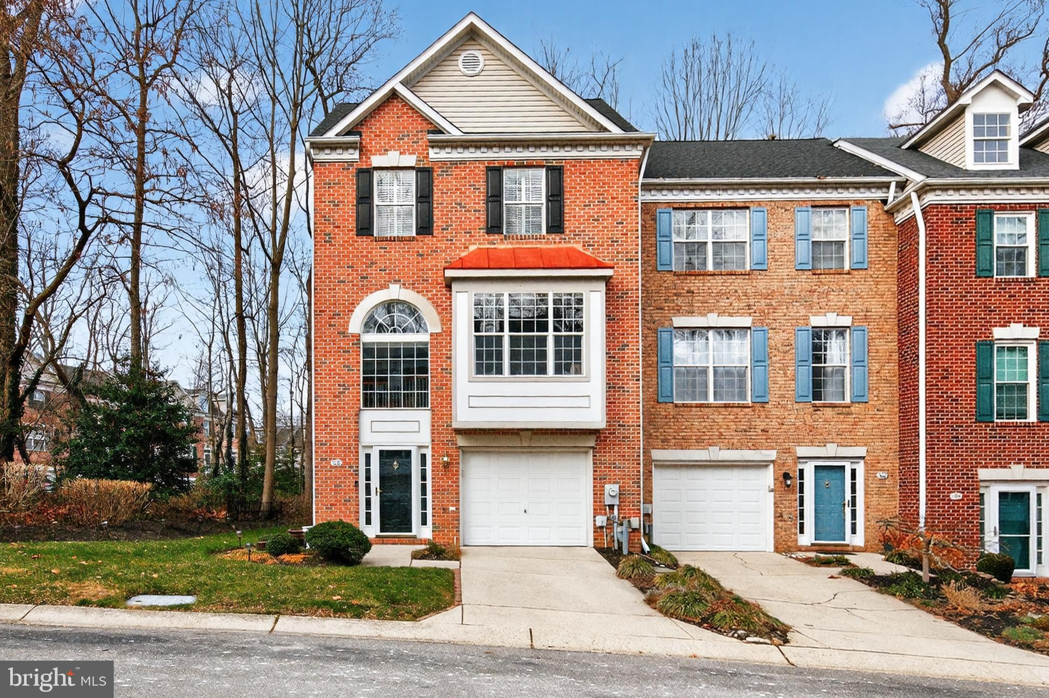 PRICE ADJUSTMENT -- BRICK END-UNIT in Waters Edge community featuring Boadneck schools and shopping. Maximum natural light provided by bump-out bay, palladium and side windows .  Two-story entry, 9-ft ceilings plus cathedral and vaulted ceilings and skylight on top floor provide space and open feeling.  Entry level features ceramic-tiled foyer, powder room, laundry/storage and cozy family room with gas fireplace and sliding door out to lower deck and back yard.  Upstairs is the living room with bay window, dining area, marble two-sided gas fireplace and hardwood floors.  The updated kitchen has large island with space for bar stools to sit, gas cooking and adjacent sitting area with built-in storage cabinets.  There are sliding doors here out to the large upper deck nestled into the surrounding landscape -- a magical space with special lighting.  The upper floor features a lovely primary suite with walk-in closet, vaulted ceiling and fan.  The primary bath has a whirlpool bath, shower stall, double vanity and skylight.  Two additional bedrooms on this level have vaulted ceilings, ceiling fans and ample closet space.  There is a full bath on the hallway with ceramic tile tub/shower and floor.  Elegant touches throughout include custom shades, plantation shutters, lighting fixtures, built-ins and more.  Beautifully cared for and maintained -- new gas HVAC (2024), new roof (2022), gas hot water heater (2019), newer appliances and paint/carpet.  Waters Edge community offers access to private dock/pier on Little Magothy River, walking trails around community and to Broadneck Trail for biking and a delightful playground with picnic area.  So much to enjoy here!