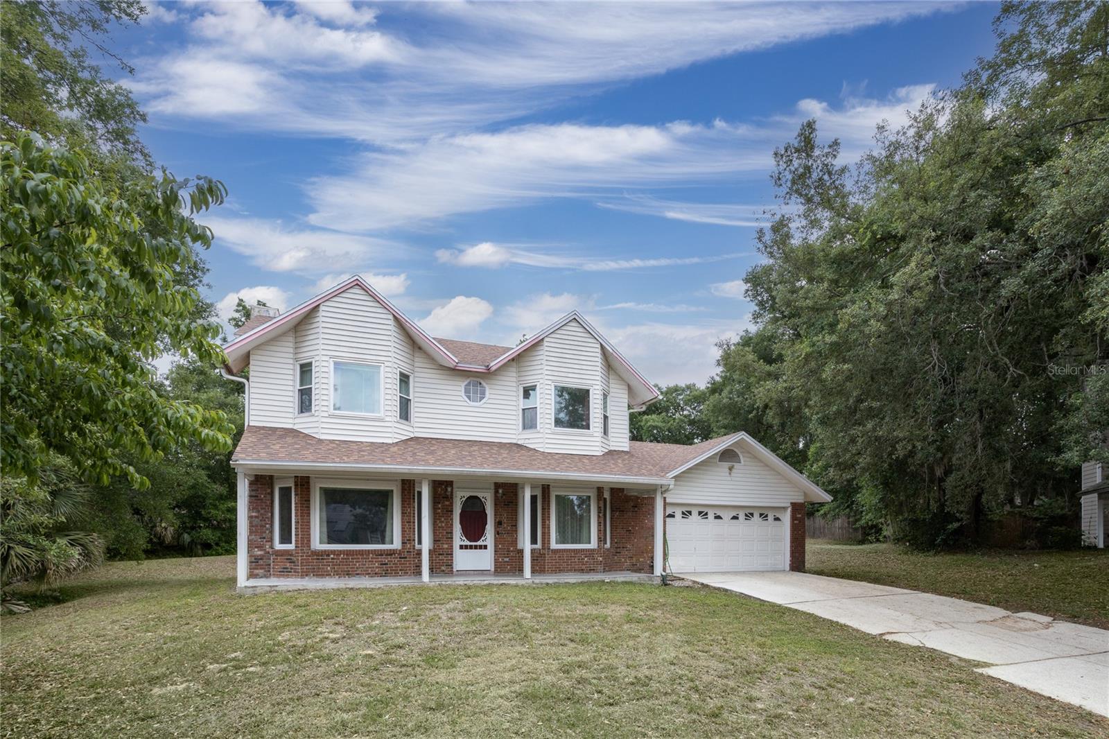 This beautiful move-in-ready two-story home offers the perfect blend of space, comfort, and modern updates. Featuring 3 bedrooms, 2.5 bathrooms, and a warm, inviting living area with a cozy fireplace. This home is filled with plenty of charm and potential. Enjoy peace of mind with major upgrades, including a new roof (2025), new ductwork (2026), AC (2017), updated plumbing (2006), windows replaced in 2014, the septic tank replaced in 2022, and all bathrooms updated in 2022. The water heater (2011) has been recently serviced, adding to the home’s reliability. The kitchen features brand-new, solid wood, soft-close cabinets (2026), offering both style and durability. A spacious laundry room and a screened-in patio provide the perfect setup for everyday convenience and outdoor entertaining, all while overlooking the peaceful, oversized backyard. With only cosmetic updates needed, this property is ideal for buyers looking to add their personal touch while enjoying the comfort of major improvements already completed. NO HOA FEES. Conveniently located near major highways, shopping, dining, the Orlando International Airport, and world-famous theme parks. This home offers both accessibility and lifestyle.