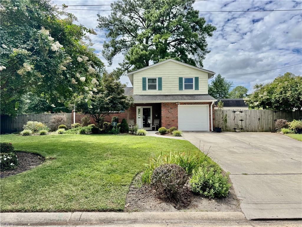 Discover your dream home in the heart of Virginia Beach, just minutes from the Oceanfront & Waterside Norfolk. Great find for military families, this tri-level gem offers close proximity to multiple military bases & easy access to the Virginia Beach Expressway.  On the top level there are 3 spacious bedrooms with 1.5 baths. The middle level boasts a well-appointed kitchen, dining area & a generous great room, ideal for gatherings. Venture to the lower level, where a cozy family room awaits, complete with sliding glass doors that seamlessly connect to a vast backyard—suited for entertaining.  The outdoor space is a highlight, featuring ample concrete for a potential patio or additional parking, along with a 2-story shed offering approximately 140sqft of versatile storage. Enjoy the tranquility of your fenced yard, with Malibu Elementary, shopping and restaurants just minutes away.  Don’t miss this unique opportunity to own a slice of Virginia Beach paradise! Schedule your showing today!