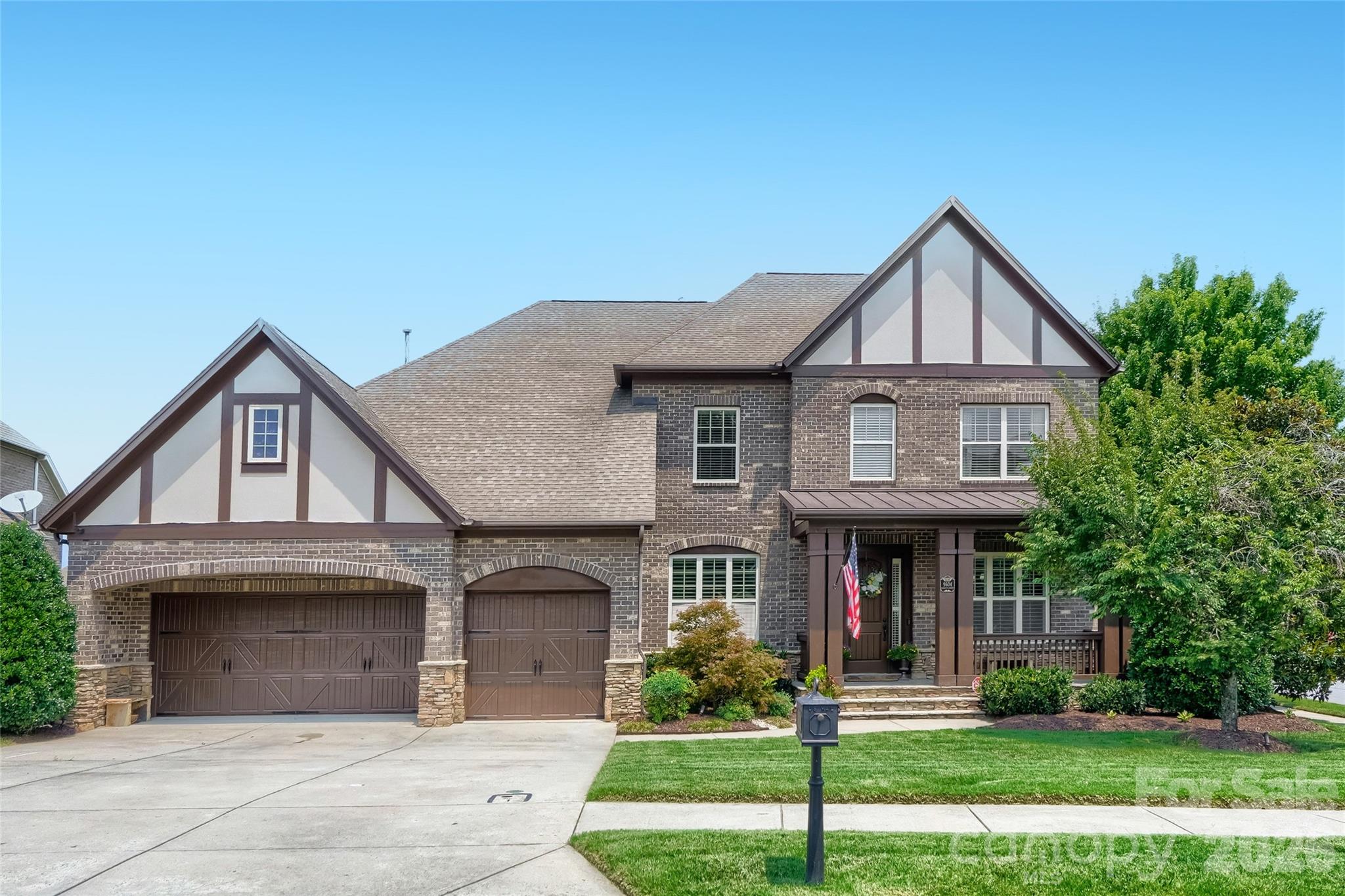 Welcome to 9604 Ashley Green Ct NW, Concord, NC 28027, a beautiful full-brick home located in the highly sought-after Christenbury neighborhood near Concord Mills. Offering an ideal combination of space, comfort, convenience, and resort-style community amenities, this home is perfectly positioned for buyers searching for a Concord NC home with a main-level primary suite, 3-car garage, private backyard, and easy access to Charlotte.Step inside to discover stunning hardwood floors and spacious living areas designed for both everyday living and entertaining. The impressive great room features a dramatic floor-to-ceiling stone fireplace and a wall of windows overlooking the backyard. The kitchen offers generous cabinetry, stainless steel appliances, ample counter space, and a large island with seating, while a dedicated main-level office provides an ideal work-from-home space.The primary bedroom is conveniently located on the main floor, offering privacy and easy one-level living. Upstairs, you'll find three additional bedrooms, a loft, and a large media/bonus room, creating flexible space for guests, recreation, a home theater, fitness room, or second living area. A huge unfinished walk-in storage area provides exceptional storage without sacrificing living space.Outside, enjoy a covered back patio overlooking the fully fenced, private backyard—a wonderful setting for morning coffee, grilling, entertaining, or simply relaxing. The 3-car garage provides plenty of room for vehicles, storage, hobbies, or recreational gear.Living in Christenbury in Concord, NC means enjoying the outstanding Cox Mill School district and the award winning neighborhood amenities, including a community swimming pool, clubhouse, playground, sports courts, walking trails, and recreation areas. The location is equally impressive, just minutes from Concord Mills, shopping, restaurants and entertainment, with convenient access to Northlake, Birkdale Village, I-85, I-485 and I-77. Uptown Charlotte is approximately 25 minutes away, making this an excellent option for buyers looking for more space. while remaining convenient to the Charlotte metro area.