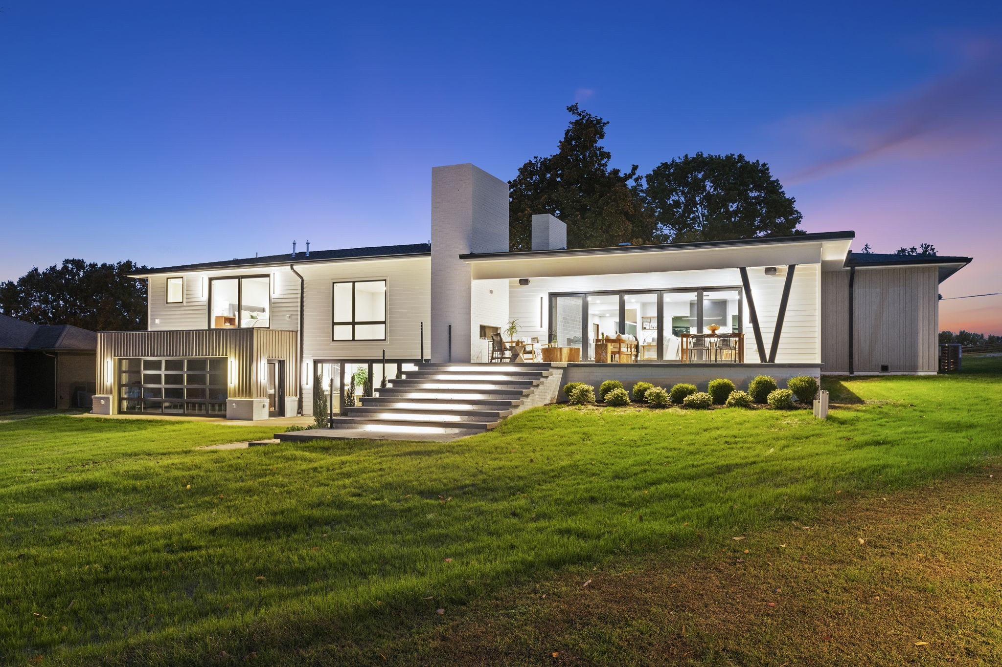 LUXURY LAKEFRONT ESTATE....103 Walnut Dr. makes dreams come true, defining elegance, seamless integration w/ your natural surroundings & a statement about your hard work & success. The lakefront home where mornings begin w/soft light & calming waters set the tone for the day. Attention to detail is seen in every phase of thoughtful construction & its state-of-the-art modern conveniences reflecting your journey of uniqueness & style. These midcentury modern feels pristine w/ clean lines exceeding contemporary expectations while staying intimate w/its natural setting. The kitchen is designed w/attention to detail-Wolf appliances, sleek custom cabinetry, hard surface counters and tile that complement a lake house setting. Expansive Pella windows showcasing your priceless views as part of the experience of integrating with your environ from nearly every room. A 60" vent-free fireplace anchors the main living area, adding warmth to the open layout as the space flows easily - open, yet with spots to gather. This one-of-a-kind FULLY AUTOMATED custom home includes Nano glass wall systems in the living rm & lower den. All bedrooms are en suite w/heated bath floors & elevated underlit vanities. Over 400K in mill work further enhances the beauty of this estate for those who can appreciate what separates your unique individuality from the ordinary w/inset linear registers, inset base boards, decorator plumbing fixtures & lighting inside & out. Lutron control system operates blinds & lighting remotely w/400 AMP service located in the 4-car garage. Outdoor areas feature two stainless fireplaces w/LED lighting & sound control. Covered boat dock features a new roof, electricity, water & hydraulic boat lift. 103 Walnut Dr. located on Old Hickory Lake is more than a location; it's a lifestyle where tradition meets tomorrow. Exterior back of the home has been wired and preset for a future pool.